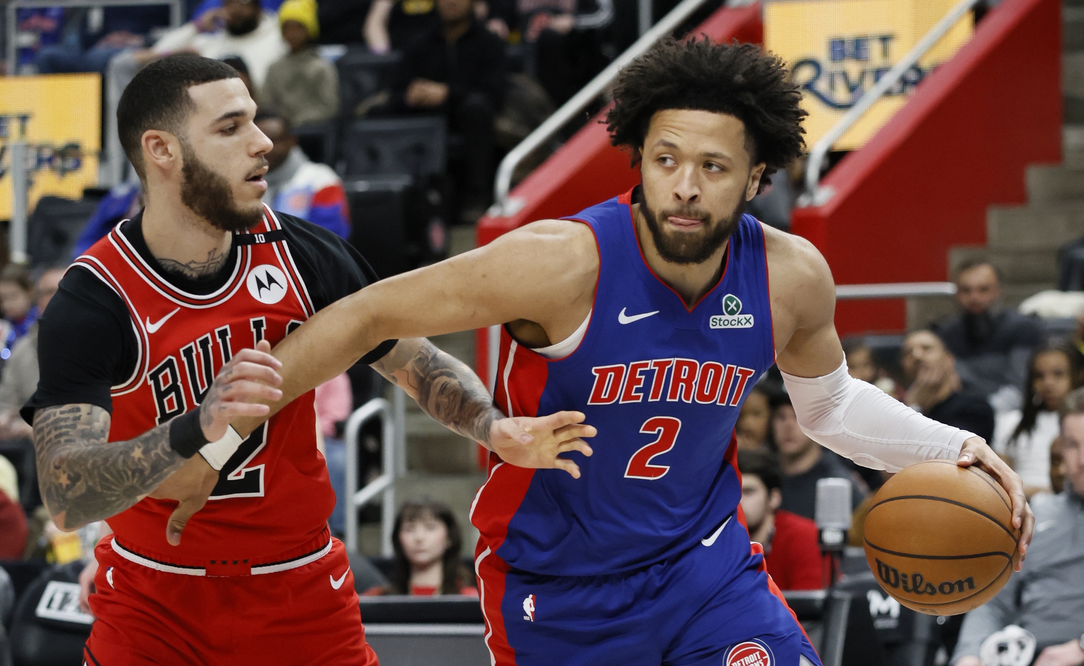 Detroit Pistons guard Cade Cunningham, right, drives to the basket against Chicago Bulls guard Lonzo Ball, left, during the first half of an NBA basketball game Sunday, Feb. 2, 2025, in Detroit. 