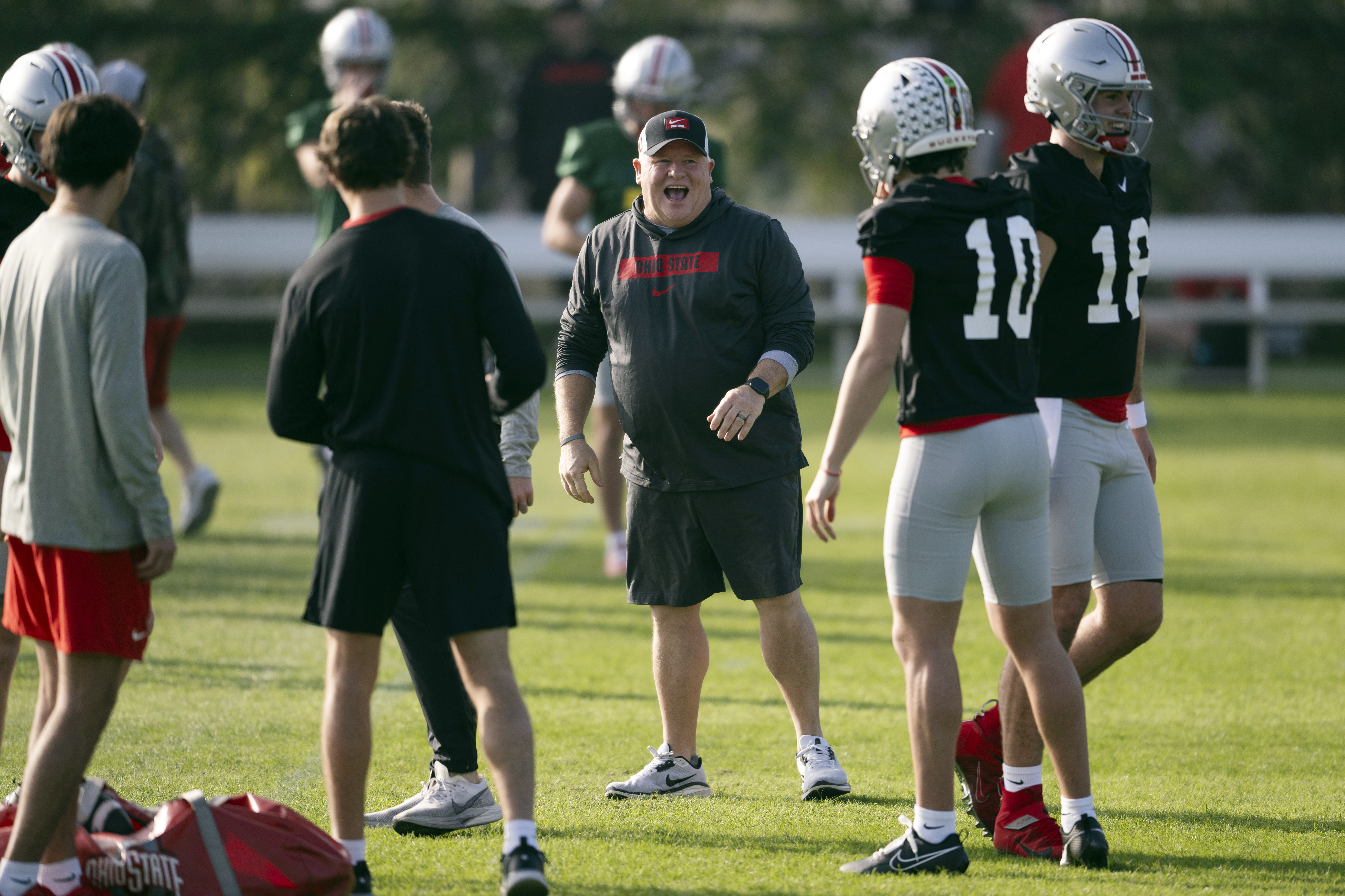 FILE - Ohio State offensive coordinator Chip Kelly laughs during practice in Carson, Calif., Monday, Dec. 30, 2024, ahead of Rose Bowl College Football Playoff game against Oregon. 