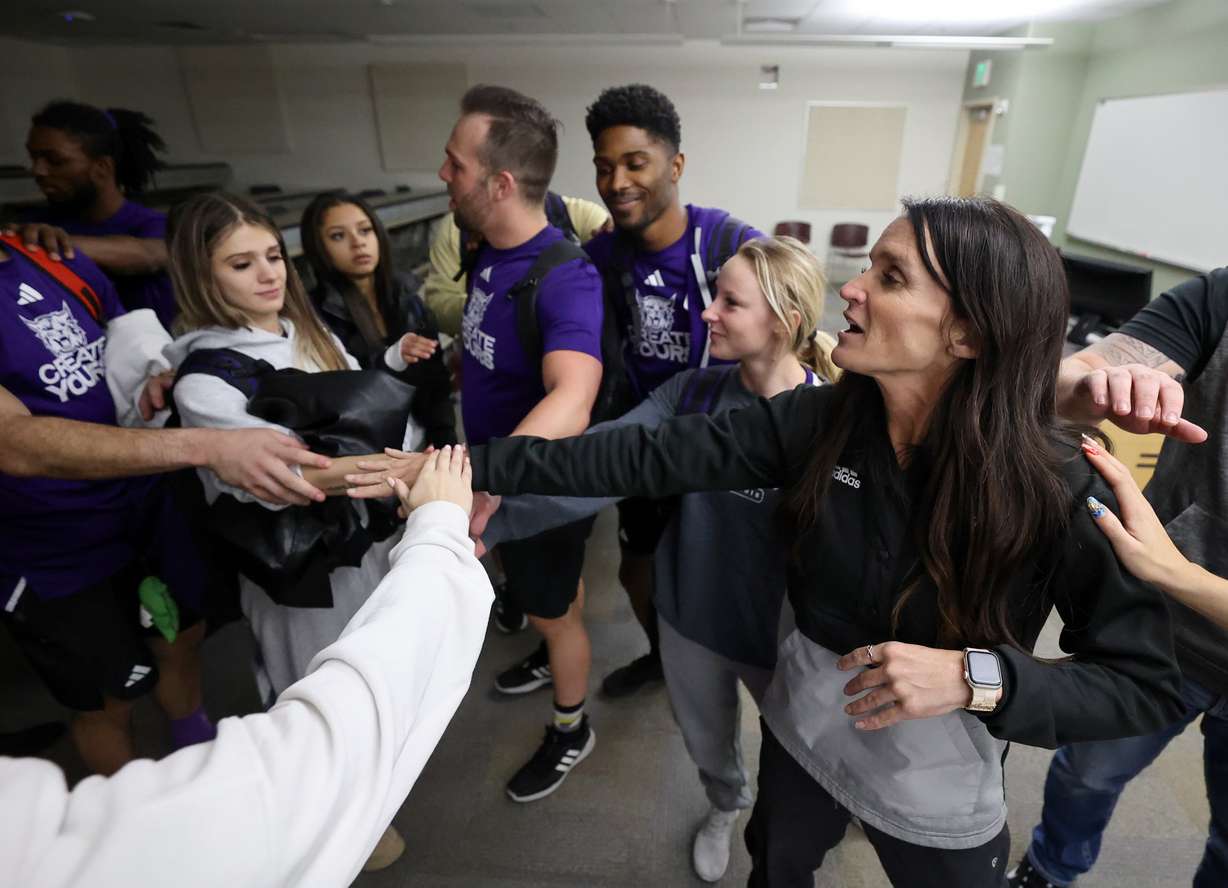 Weber State cheer coach Summer Willis, far left, huddles up with cheerleaders after practice at Weber State University in Ogden on Jan. 27.