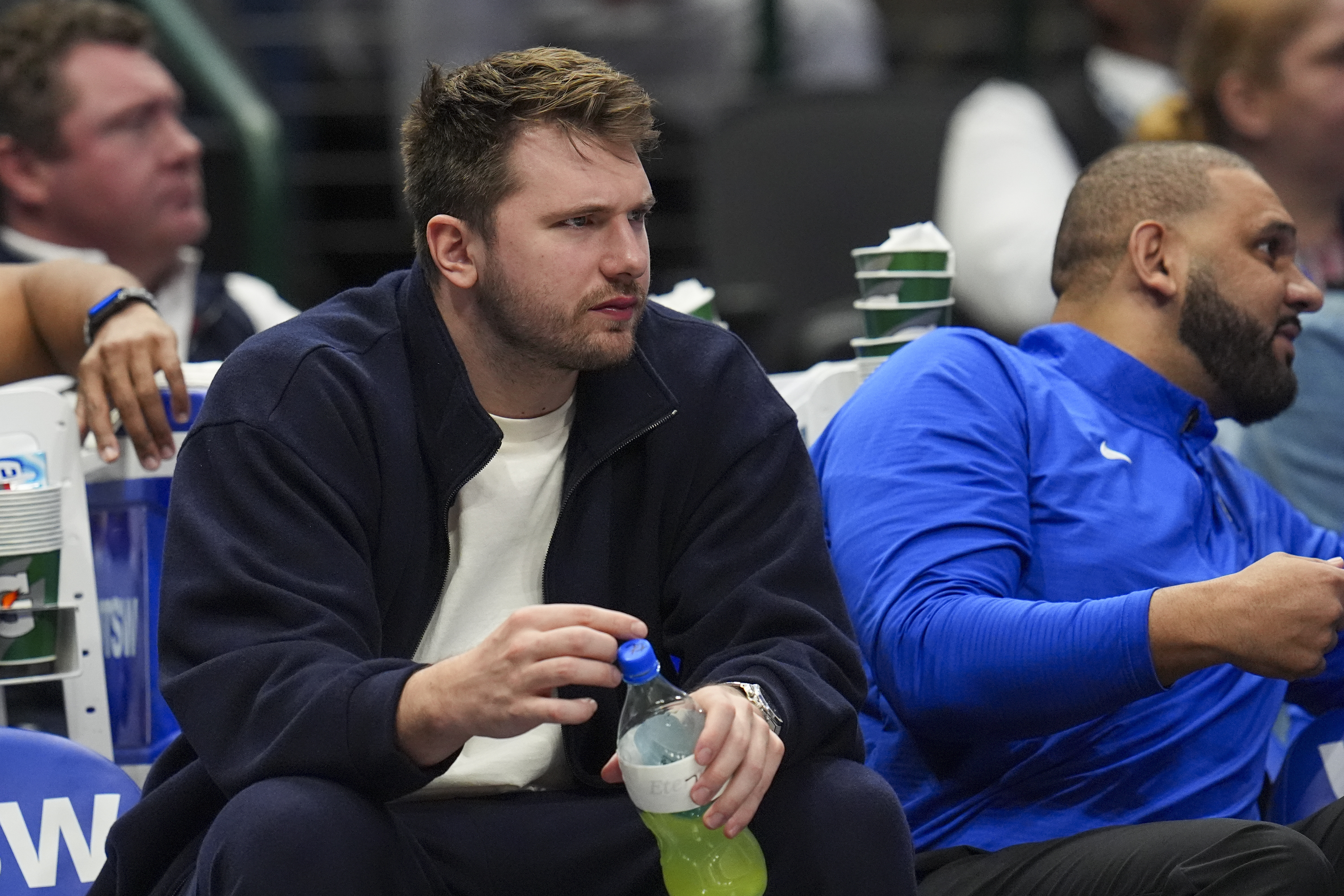 Dallas Mavericks guard Luka Doncic looks on from the bench during the second half of an NBA basketball game against the Denver Nuggets, Sunday, Jan. 12, 2025, in Dallas. The Nuggets won 112-101. 