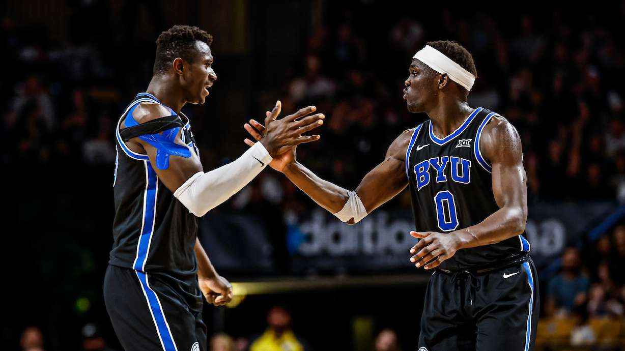 BYU's Keba Keita, left, and Mawot Mag celebrate during the Cougars' 81-75 win over UCF during a Big 12 men's basketball game at Addition Financial Arena, Saturday, Feb. 1, 2025 in Orlando, Fla.