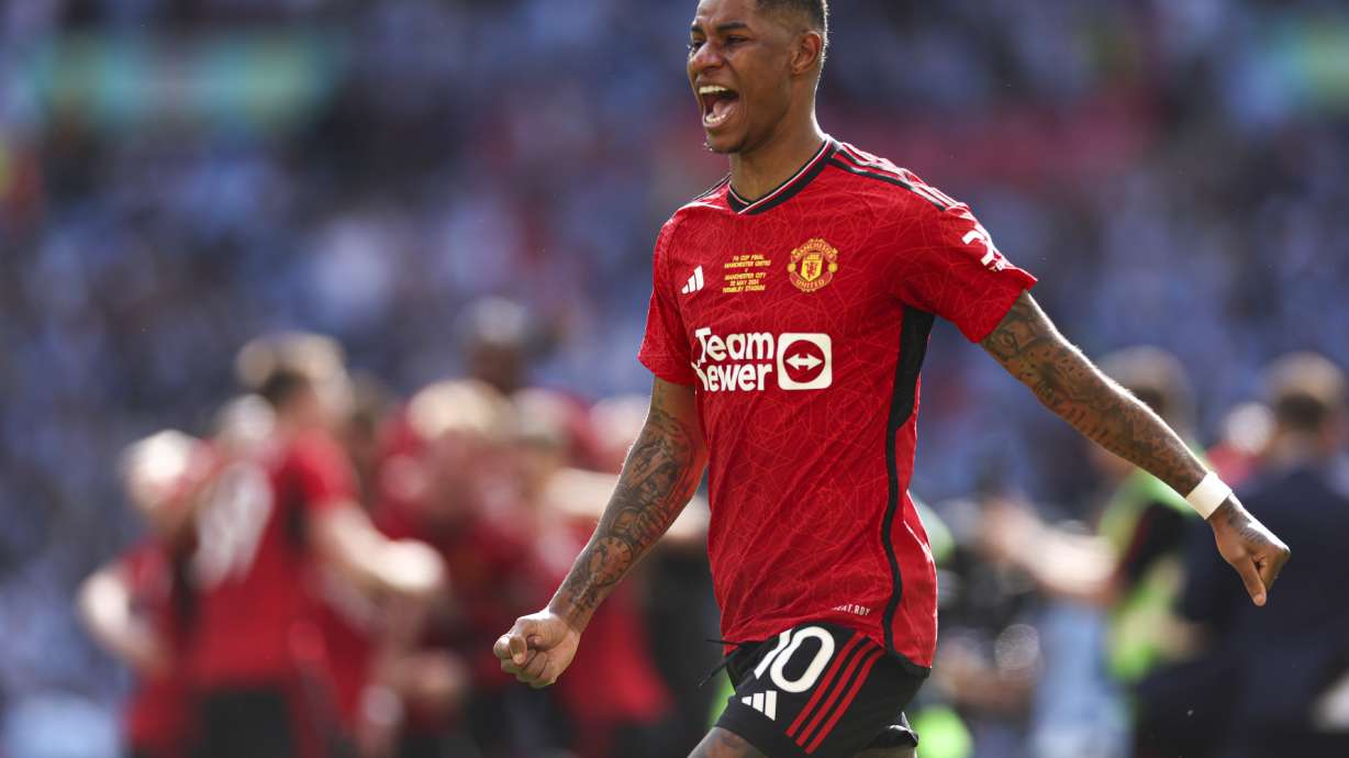 FILE - Manchester United's Marcus Rashford celebrates after his team won the English FA Cup final soccer match between Manchester City and Manchester United at Wembley Stadium in London, on May 25, 2024.