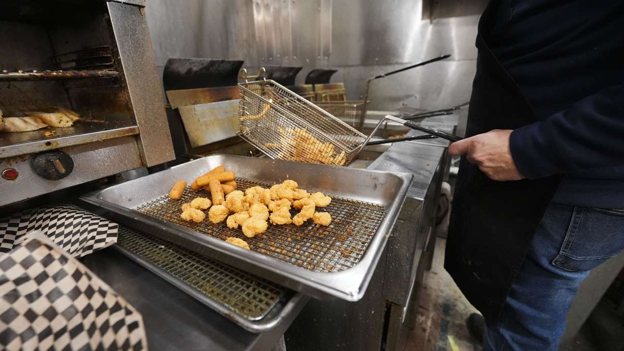 Fried shrimp are served up in the kitchen of Central Poboys in Jefferson Parish, La., a suburb of New Orleans, Friday, Jan. 24, 2025.