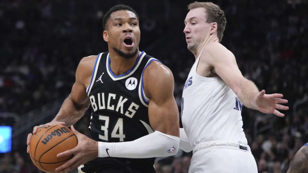 Milwaukee Bucks' Giannis Antetokounmpo tries to get past Memphis Grizzlies' Luke Kennard during the first half of an NBA basketball game Sunday, Feb. 2, 2025, in Milwaukee.