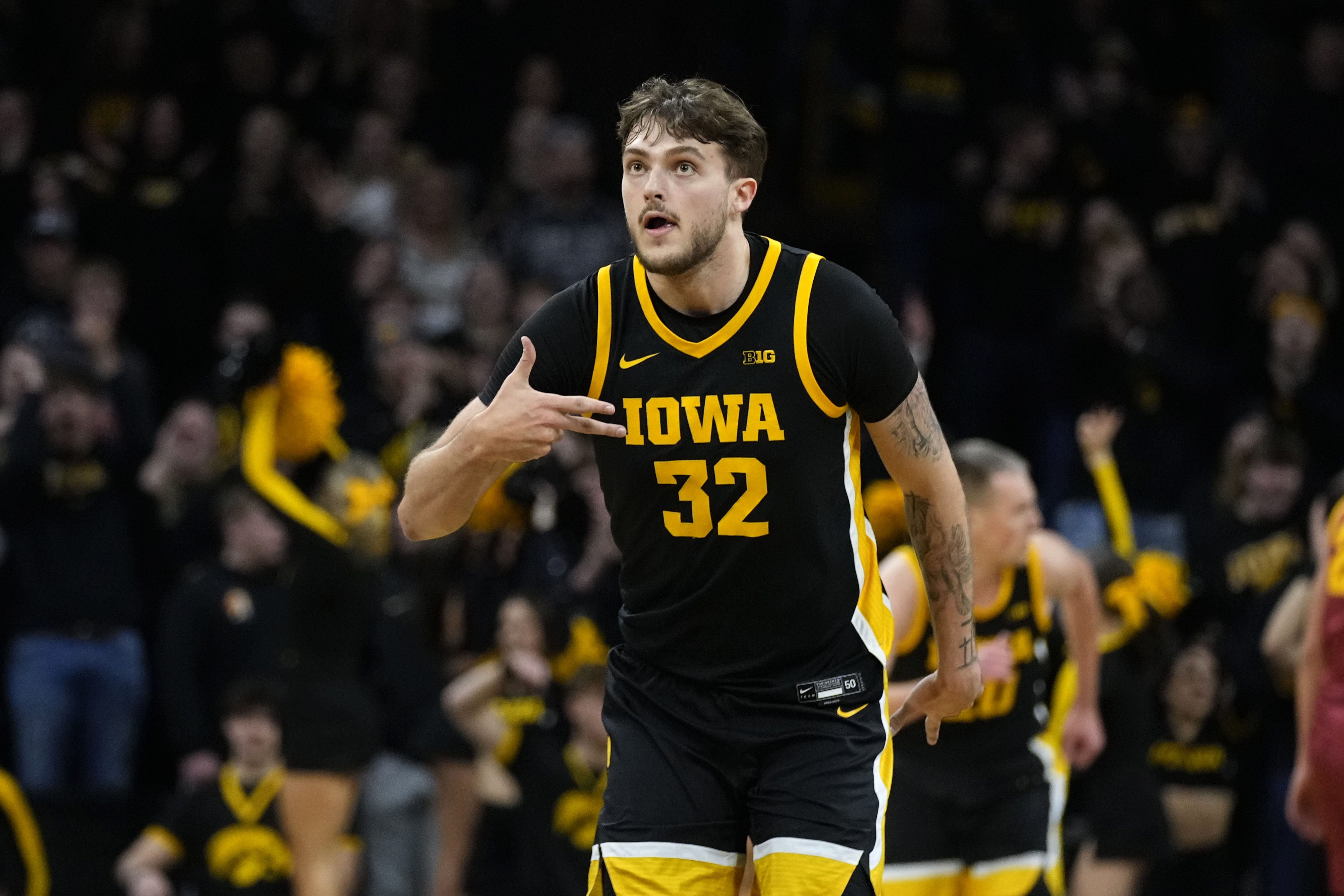 FILE - Iowa forward Owen Freeman celebrates after making a three-point basket during the first half of an NCAA college basketball game against Iowa State, Thursday, Dec. 12, 2024, in Iowa City, Iowa. 
