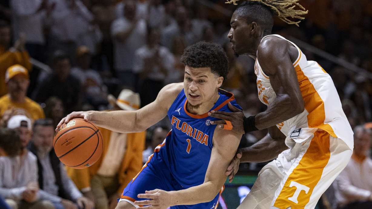 Florida guard Walter Clayton Jr. (1) drives against Tennessee guard Jahmai Mashack (15) during the second half of an NCAA college basketball game Saturday, Feb. 1, 2025, in Knoxville, Tenn.