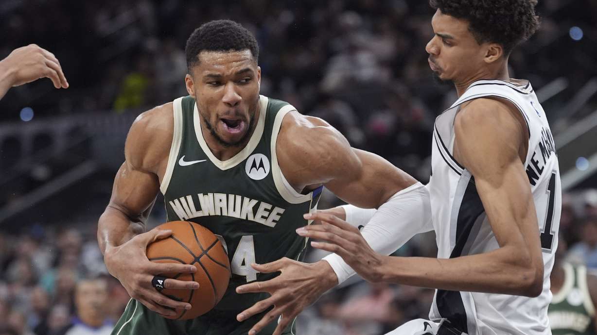 Milwaukee Bucks forward Giannis Antetokounmpo, left, drives against San Antonio Spurs center Victor Wembanyama (1) during the first half of an NBA basketball game in San Antonio, Friday, Jan. 31, 2025.