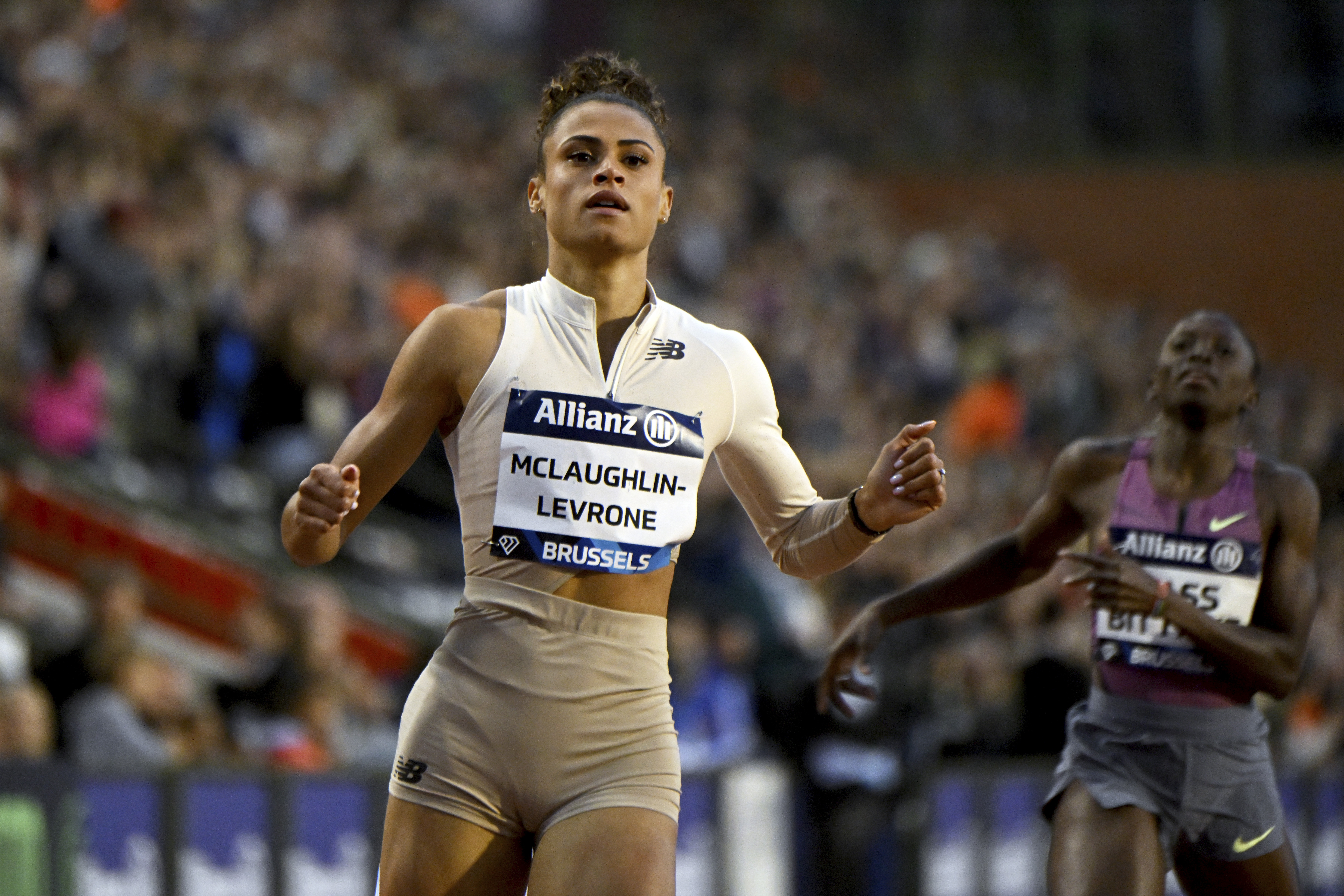 FILE - Sydney Mclaughlin-Levrone, of the United States, crosses the finish line to win a women's 200 meters invitational race during the Diamond League final 2024 athletics meet in Brussels, Sept. 14, 2024. 