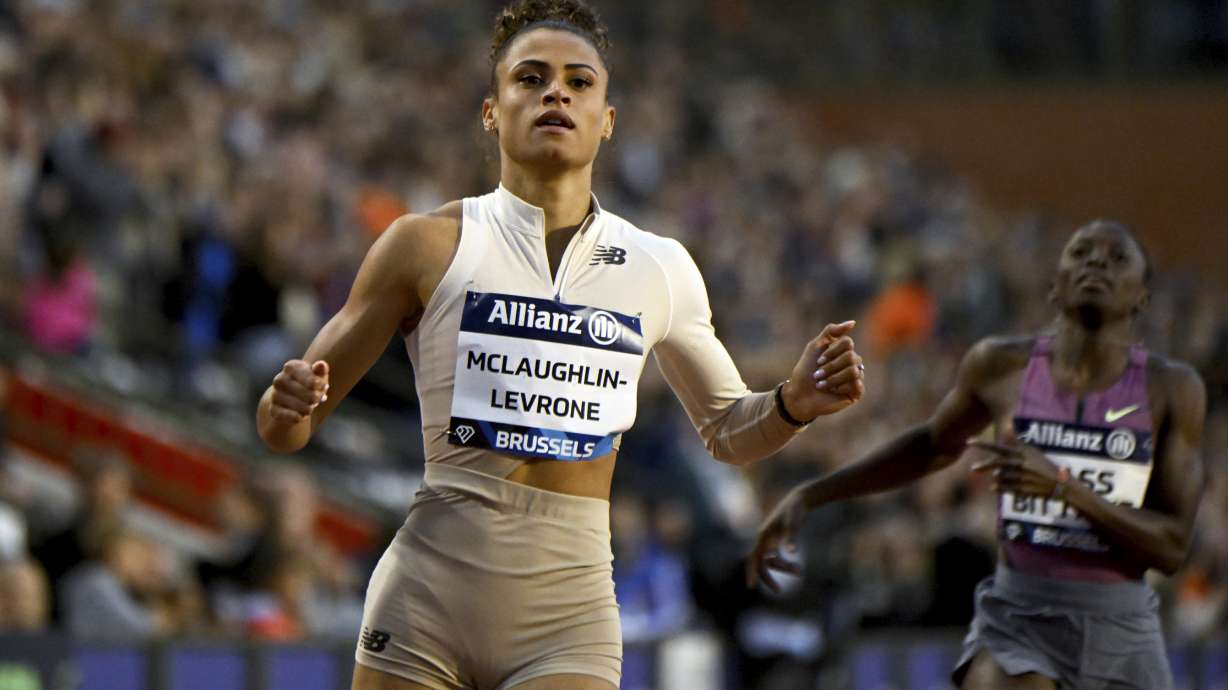 FILE - Sydney Mclaughlin-Levrone, of the United States, crosses the finish line to win a women's 200 meters invitational race during the Diamond League final 2024 athletics meet in Brussels, Sept. 14, 2024.