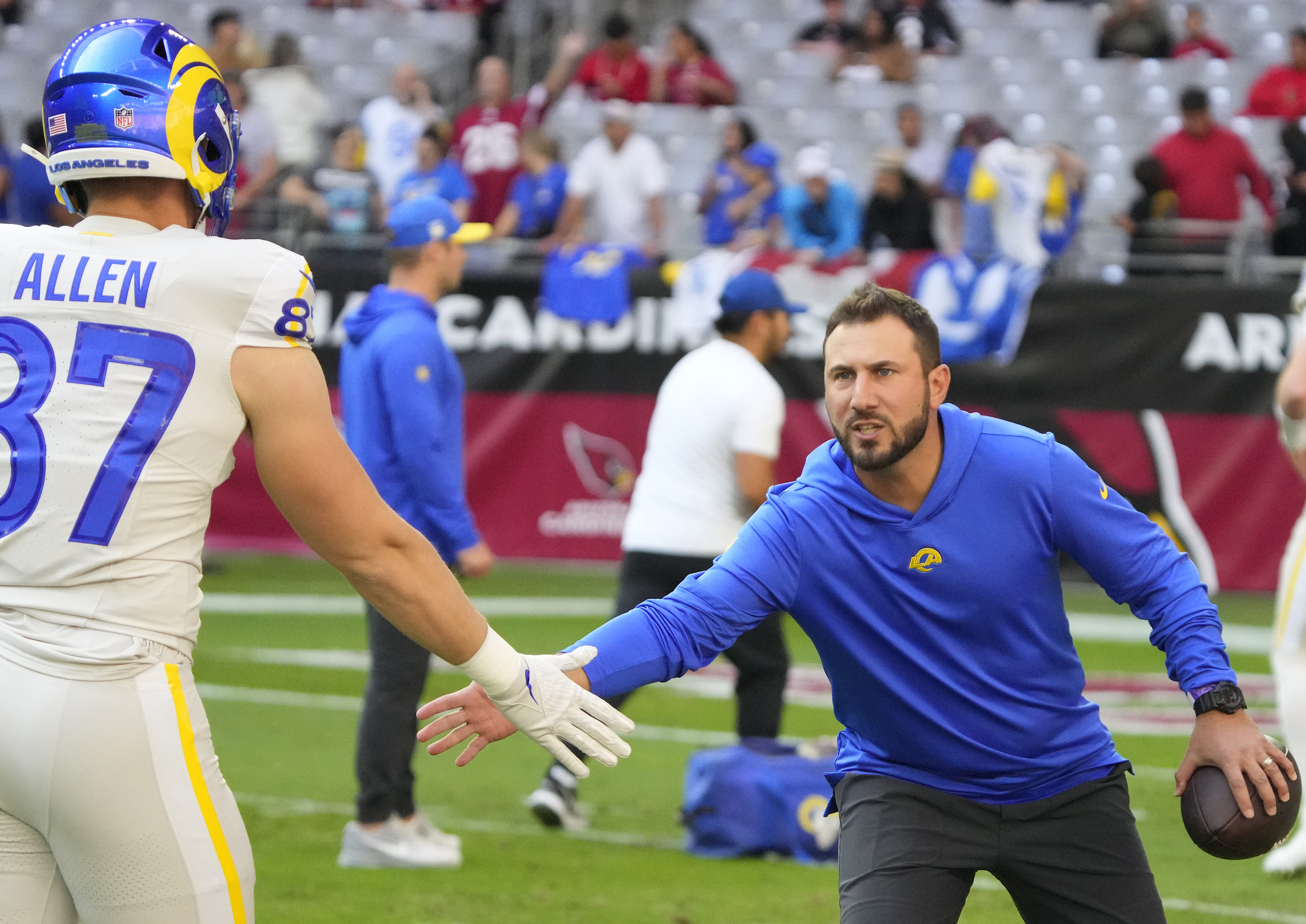 FILE - Los Angeles Rams tight ends coach Nick Caley, right, reacts with tight end Davis Allen, left, during the first half of an NFL football game against the Arizona Cardinals, Nov. 26, 2023, in Glendale, Ariz. 
