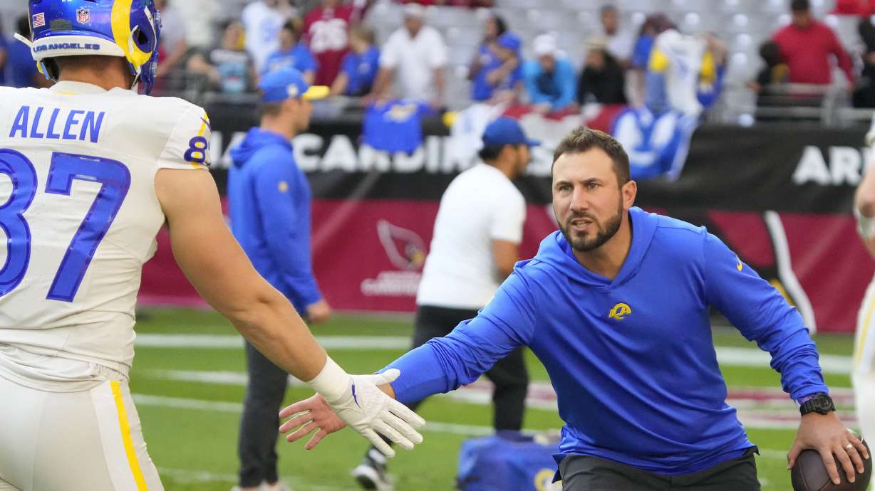 FILE - Los Angeles Rams tight ends coach Nick Caley, right, reacts with tight end Davis Allen, left, during the first half of an NFL football game against the Arizona Cardinals, Nov. 26, 2023, in Glendale, Ariz.