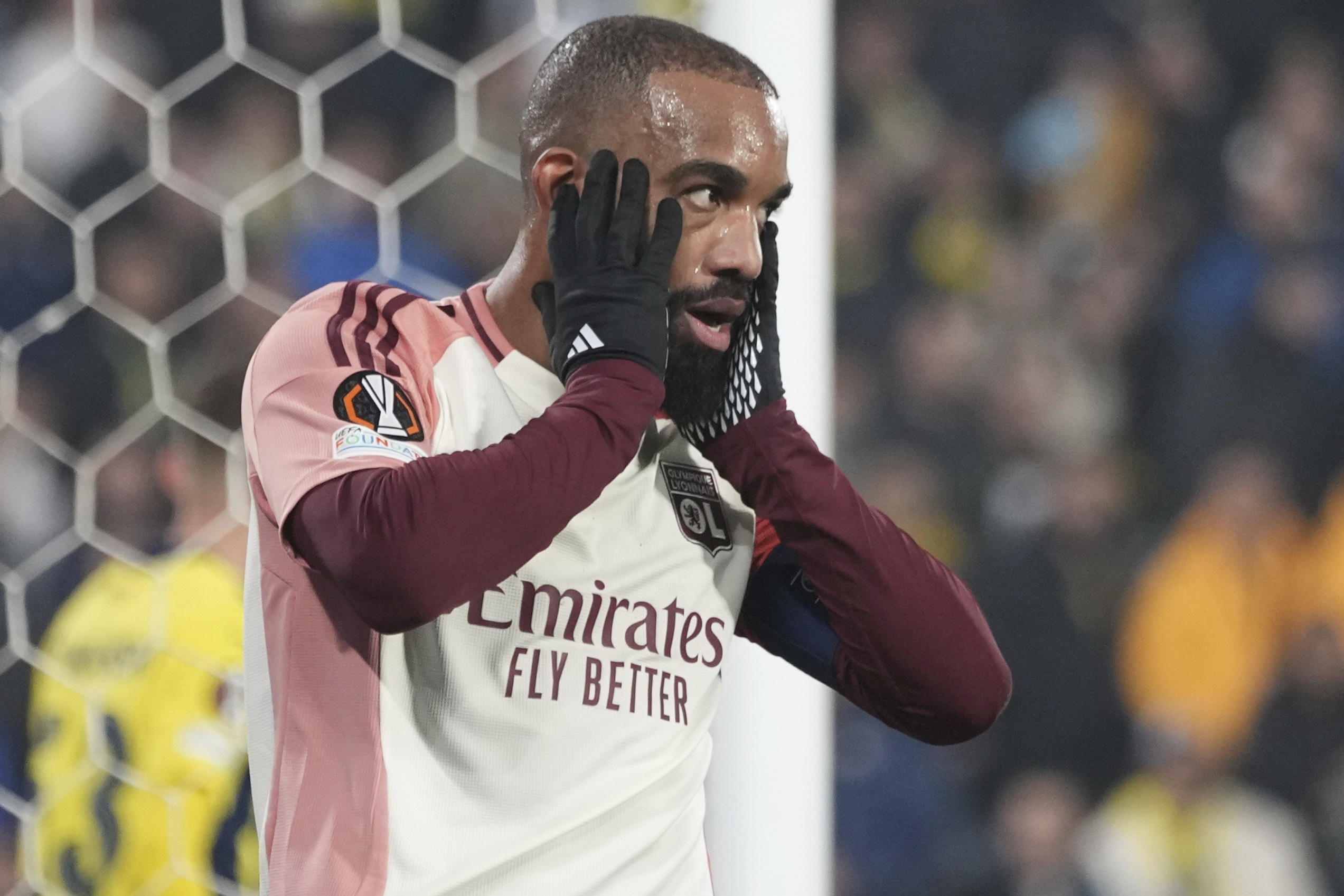 Lyon's Alexandre Lacazette reacts after missing a chance to score a goal against Fenerbahce during the Europa League opening phase soccer match at Sukru Saracoglu stadium in Istanbul, Turkey, Thursday, Jan. 23, 2025.