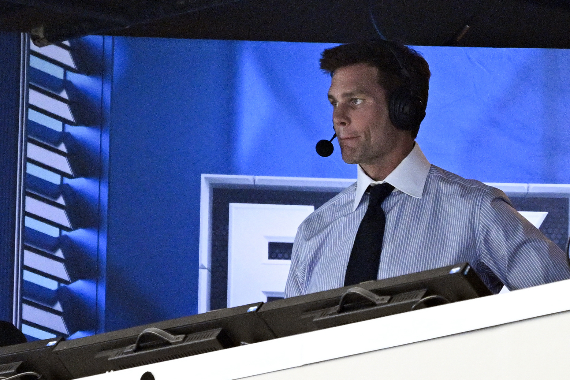 FILE 0- Former NFL quarterback Tom Brady looks on from the broadcast booth during the second half of an NFL football game between the Dallas Cowboys and the New Orleans Saints, Sunday, Sept. 15, 2024, in Arlington, Texas. 