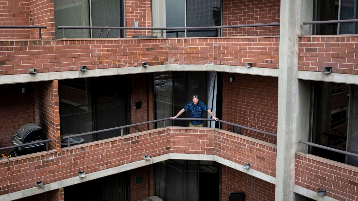 Lon Galloway poses for a portrait at his condo in Salt Lake City on Jan. 31. A dispute between Galloway and his HOA began when a $50 fine ballooned over the years to roughly $30,000 owed in fees and fines, according to Galloway’s HOA account.