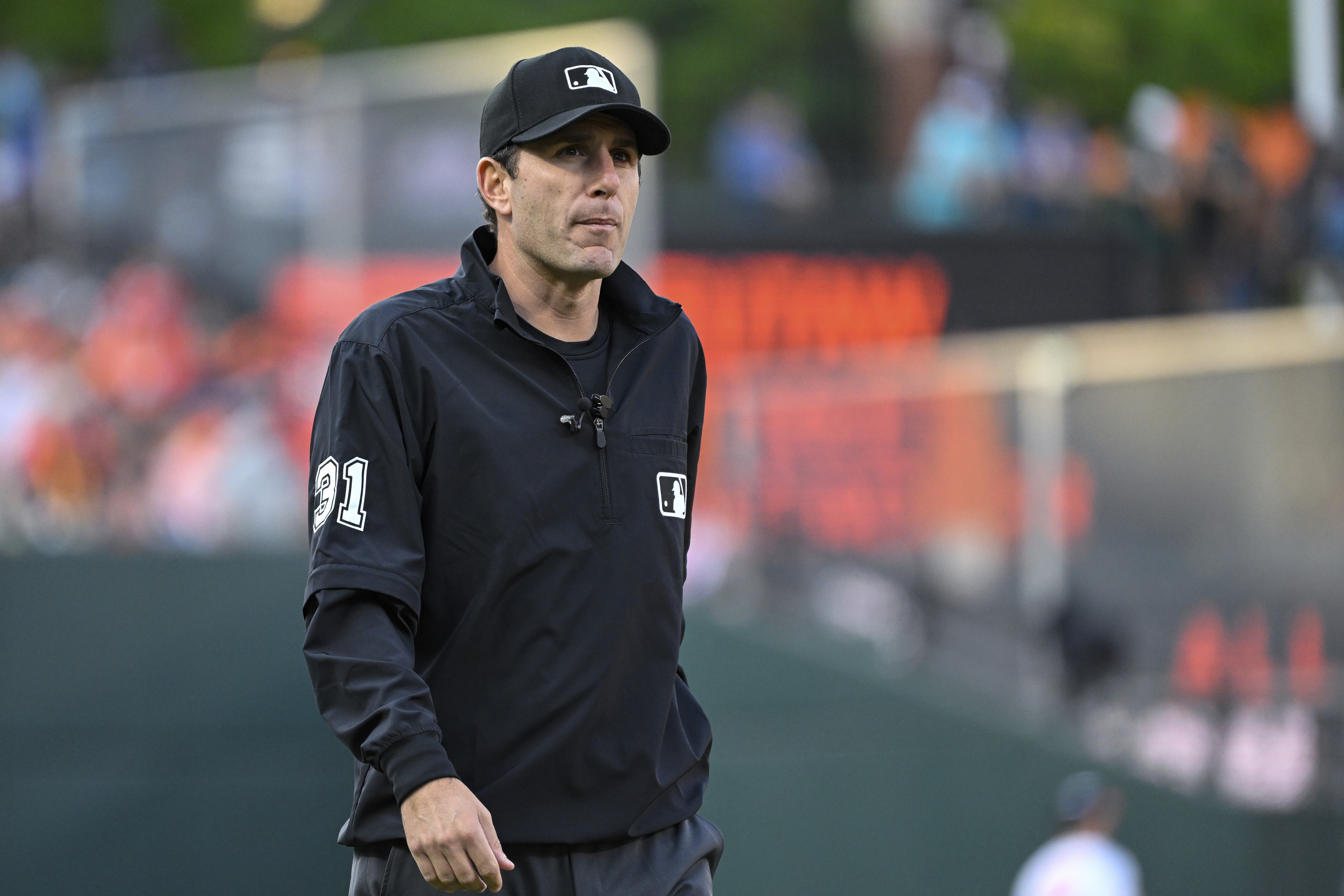 FILE - Umpire Pat Hoberg (31) looks on during a baseball game between the Baltimore Orioles and the Los Angeles Angels, May 17, 2023, in Baltimore. 