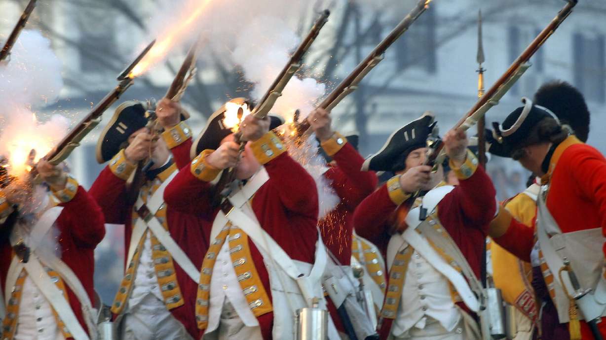 Musketeers portraying the British Army fire a volley after the retreat of the colonial militia at the annual reenactment of the 1775 Battle of Lexington, on the Battle Green, in Lexington, Mass., April 18, 2005. Patriots' Day could soon be recognized in Utah.
