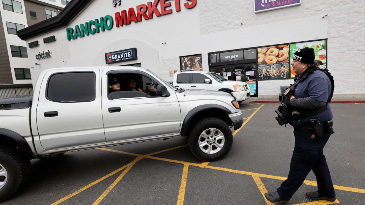 Security guard Edgar Malandaz, right, tells customers that Rancho Market is closed for A Day Without Immigrants in Salt Lake City on Monday. National immigrant advocates called on immigrants to refrain from work, shopping and school for the day.
