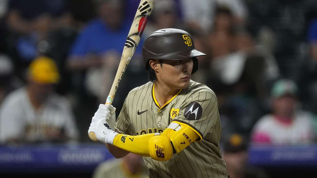 FILE - San Diego Padres shortstop Ha-Seong Kim (7) in the ninth inning of a baseball game, Aug. 17, 2024, in Denver.
