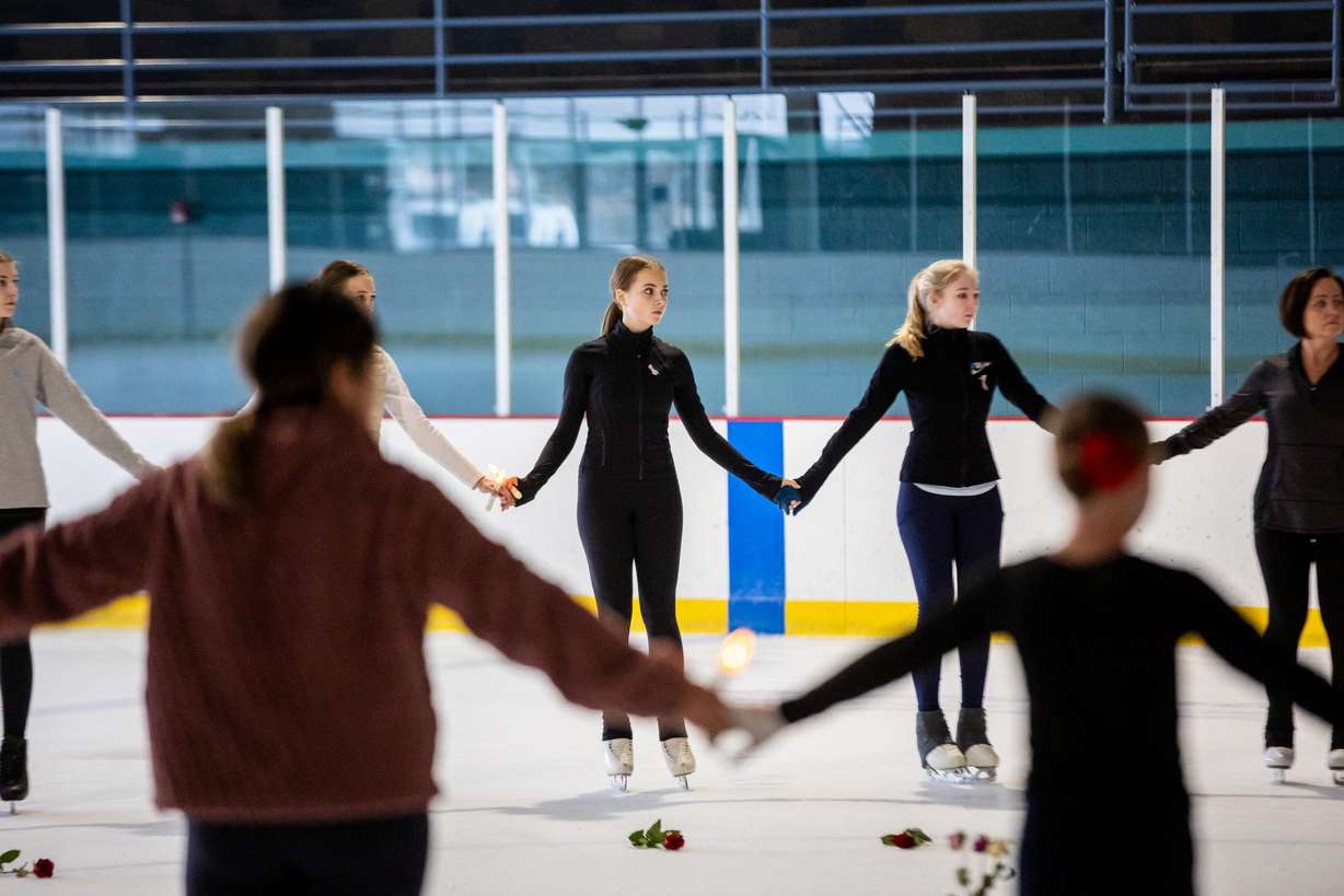 The Cottonwood Heights Figure Skating Club, in unity with skating clubs nationwide and U.S. Figure Skating, holds a Memorial Vigil in honor of the lives lost in Flight AA5342 at the Cottonwood Heights Recreation Center in Salt Lake City on Monday.