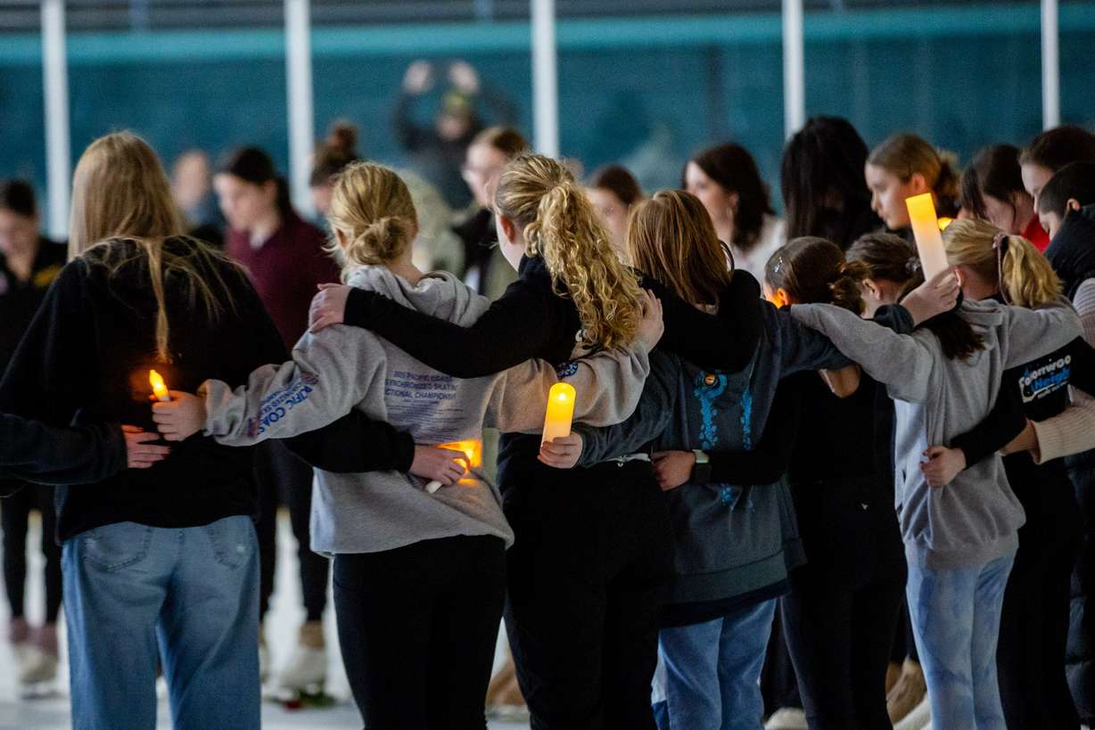 The Cottonwood Heights Figure Skating Club, in unity with skating clubs nationwide and U.S. Figure Skating, holds a Memorial Vigil in honor of the lives lost in Flight AA5342 at the Cottonwood Heights Recreation Center in Salt Lake City on Monday.