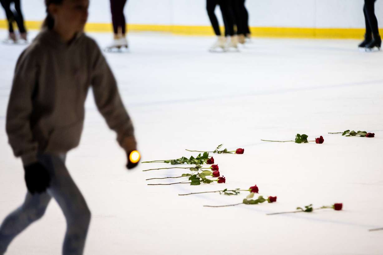 The Cottonwood Heights Figure Skating Club, in unity with skating clubs nationwide and U.S. Figure Skating, holds a Memorial Vigil in honor of the lives lost in Flight AA5342 at the Cottonwood Heights Recreation Center in Salt Lake City on Monday.