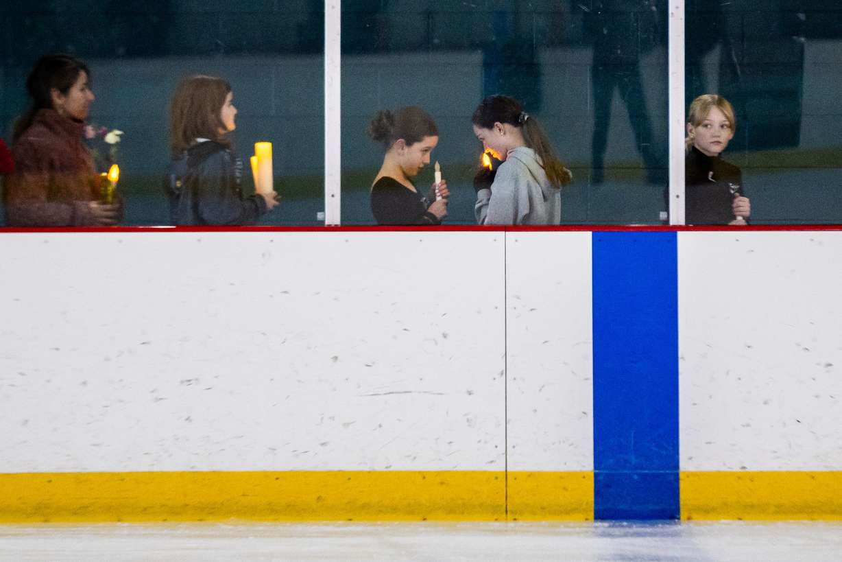 The Cottonwood Heights Figure Skating Club, in unity with skating clubs nationwide and U.S. Figure Skating, holds a Memorial Vigil in honor of the lives lost in Flight AA5342 at the Cottonwood Heights Recreation Center in Salt Lake City on Monday.