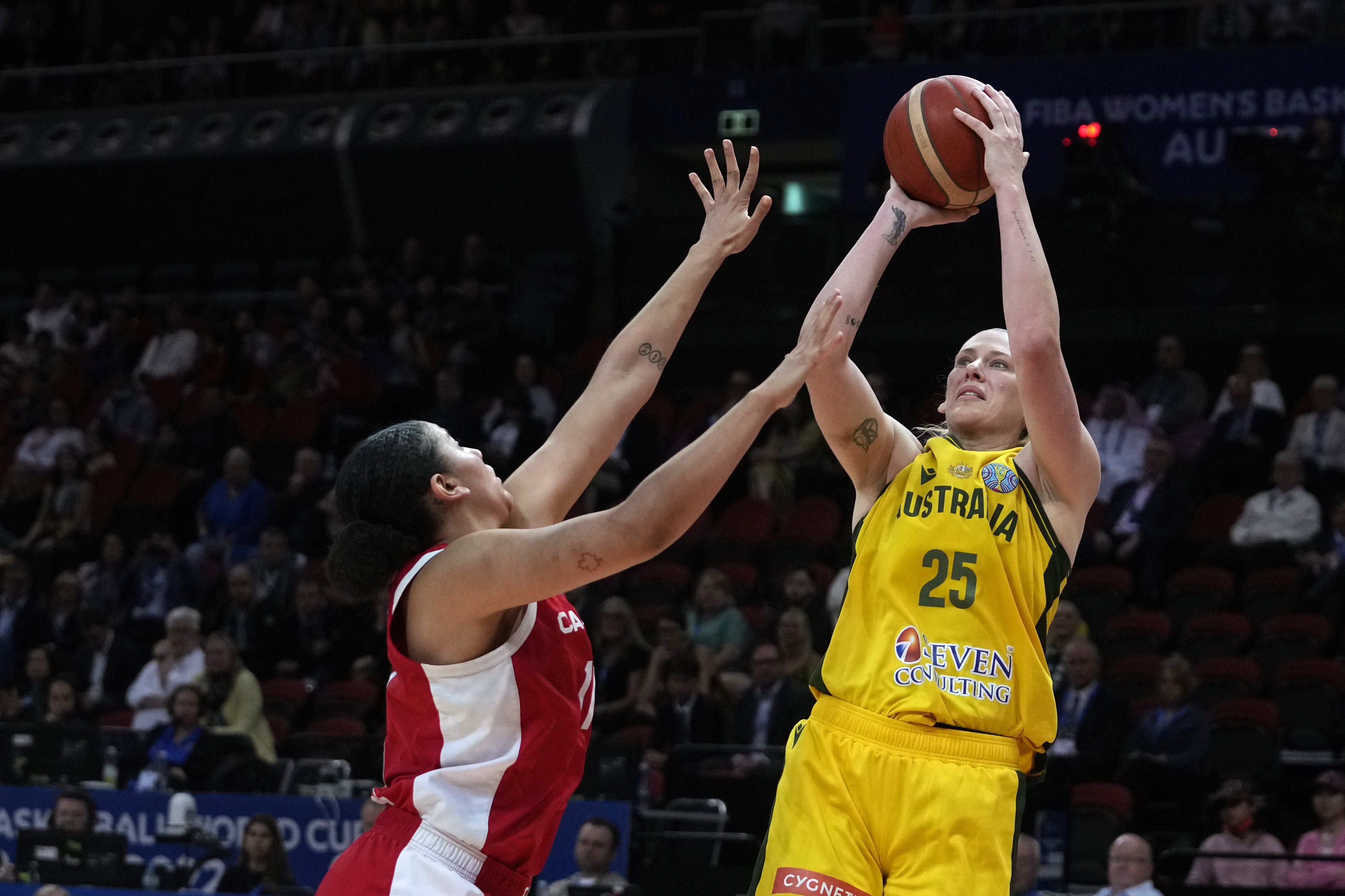 FILE - Australia's Lauren Jackson shoots over Canada's Natalie Achonwa during the bronze medal game at the women's Basketball World Cup in Sydney on Oct. 1, 2022. 