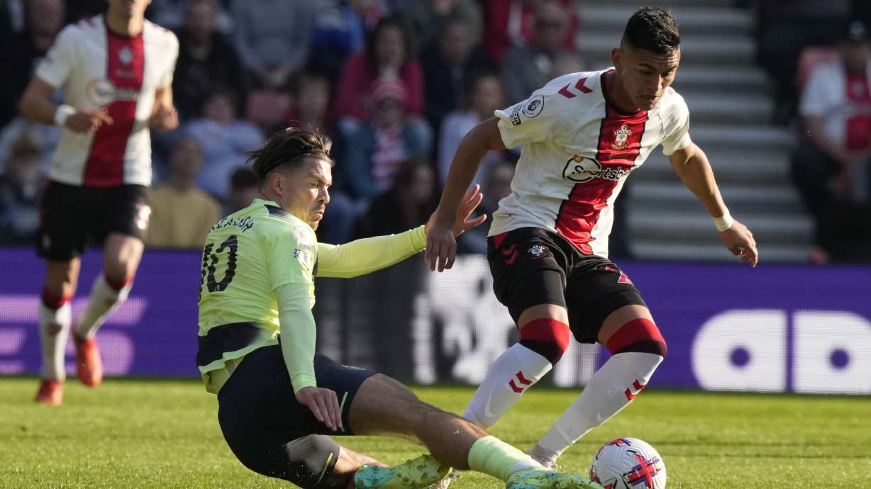 FILE - Southampton's Carlos Alcaraz, right, and Manchester City's Jack Grealish challenge for the ball during the English Premier League soccer match between Southampton and Manchester City at St Mary's Stadium in Southampton, England, on April 8, 2023.