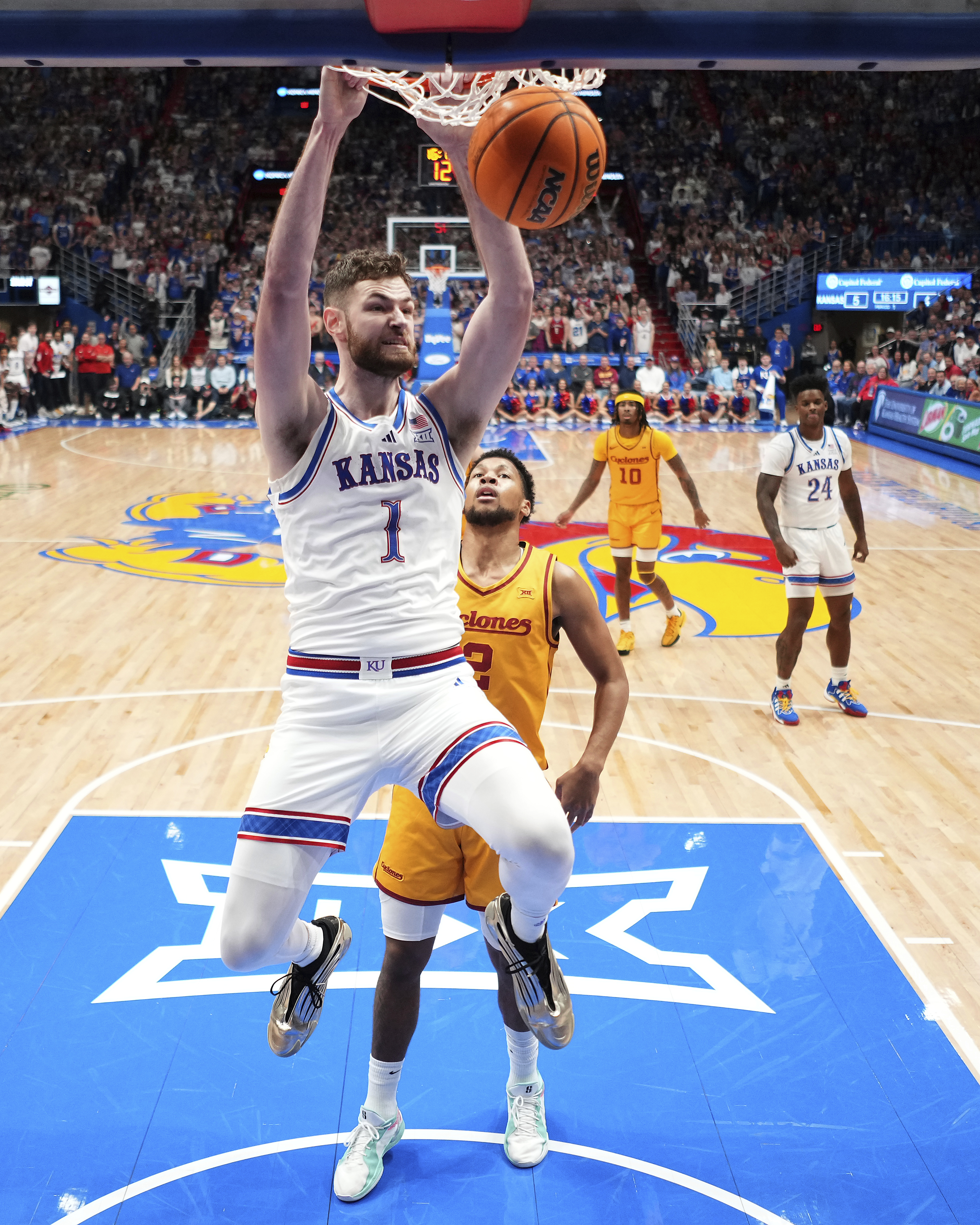 Kansas center Hunter Dickinson (1) dunks the ball during the first half of an NCAA college basketball game against Iowa State, Monday, Feb. 3, 2025, in Lawrence, Kan.