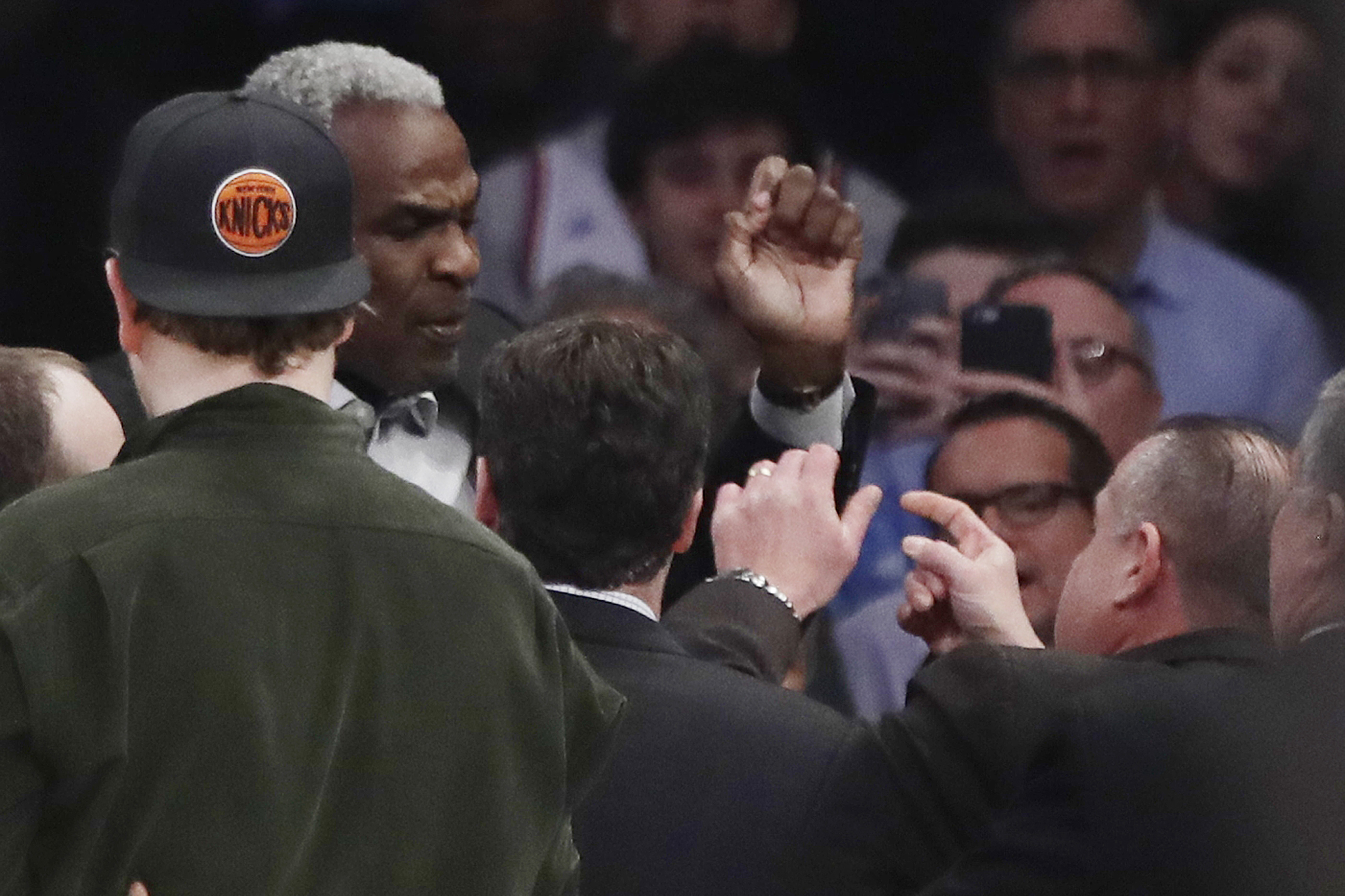 FILE - Former New York Knicks player Charles Oakley exchanges words with a security guard during the first half of an NBA basketball game between the New York Knicks and the Los Angeles Clippers, in New York's Madison Square Garden, Feb. 8, 2017. 