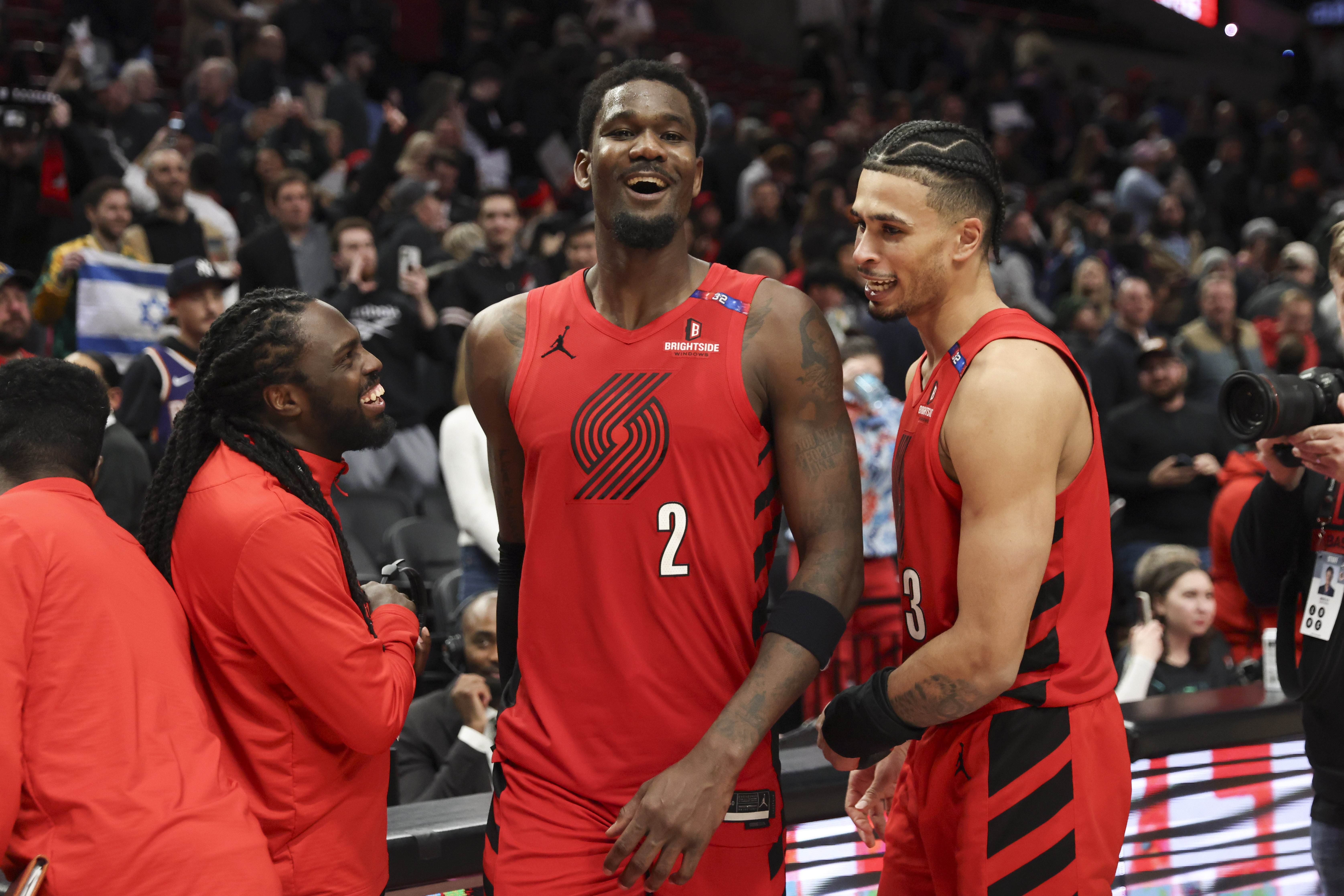 Portland Trail Blazers center Deandre Ayton (2) and forward Toumani Camara, right, celebrate following their team's win over the Phoenix Suns following an NBA basketball game Monday, Feb. 3, 2025, in Portland, Ore. 