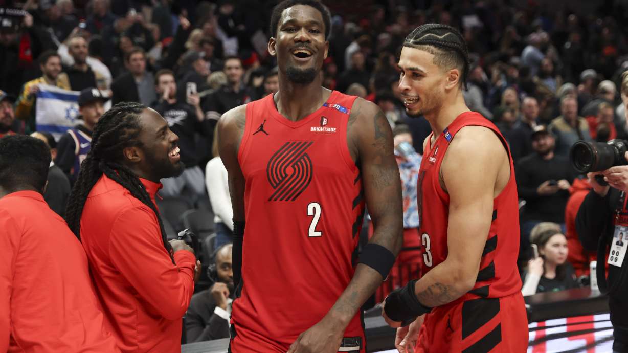 Portland Trail Blazers center Deandre Ayton (2) and forward Toumani Camara, right, celebrate following their team's win over the Phoenix Suns following an NBA basketball game Monday, Feb. 3, 2025, in Portland, Ore.