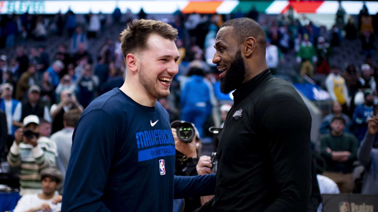 FILE - Dallas Mavericks guard Luka Doncic shares a laugh with Los Angeles Lakers forward LeBron James following an NBA basketball game in Dallas, Dec. 25, 2022. Dallas won the game by a final of 124-115.