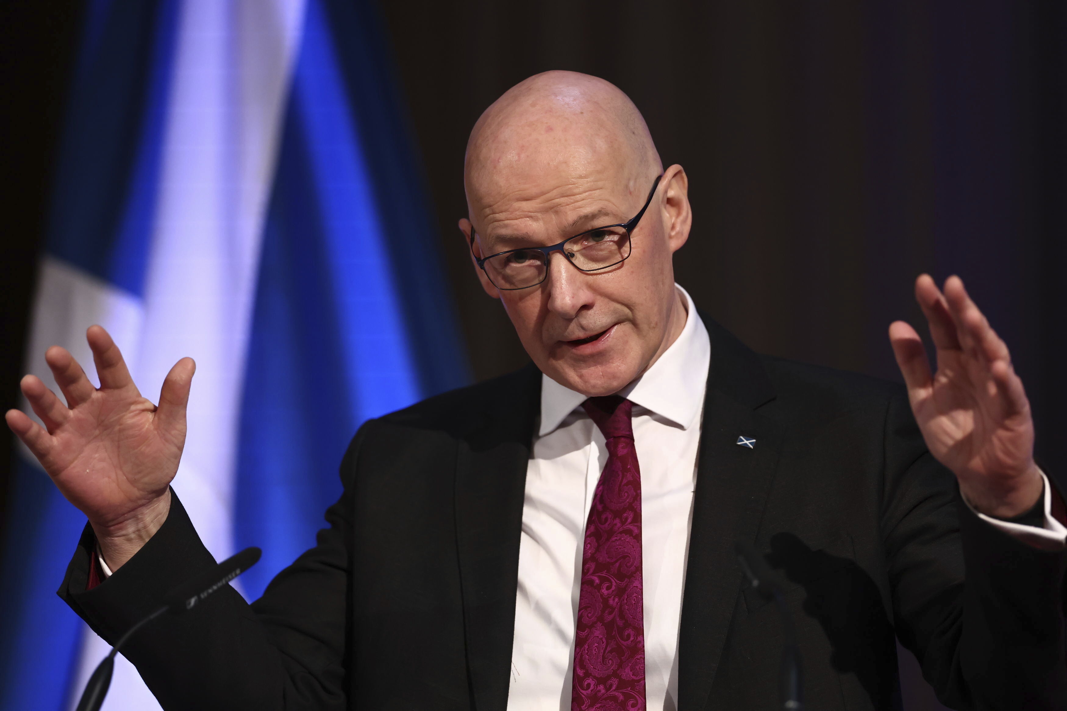 Scotland's First Minister John Swinney speaks to representatives from organizations across the public and private sector at Playfair Library in Edinburgh, Scotland. Swinney denies a plan to ban cats in Scotland.