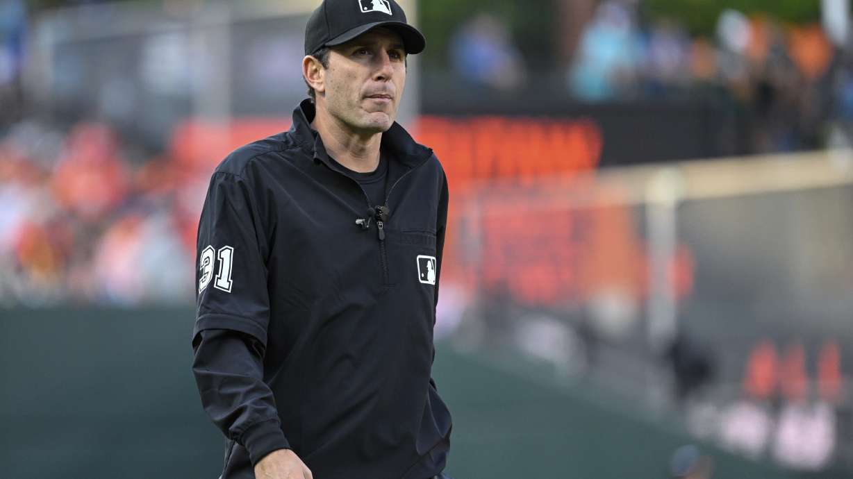 FILE - Umpire Pat Hoberg (31) looks on during a baseball game between the Baltimore Orioles and the Los Angeles Angels, May 17, 2023, in Baltimore.