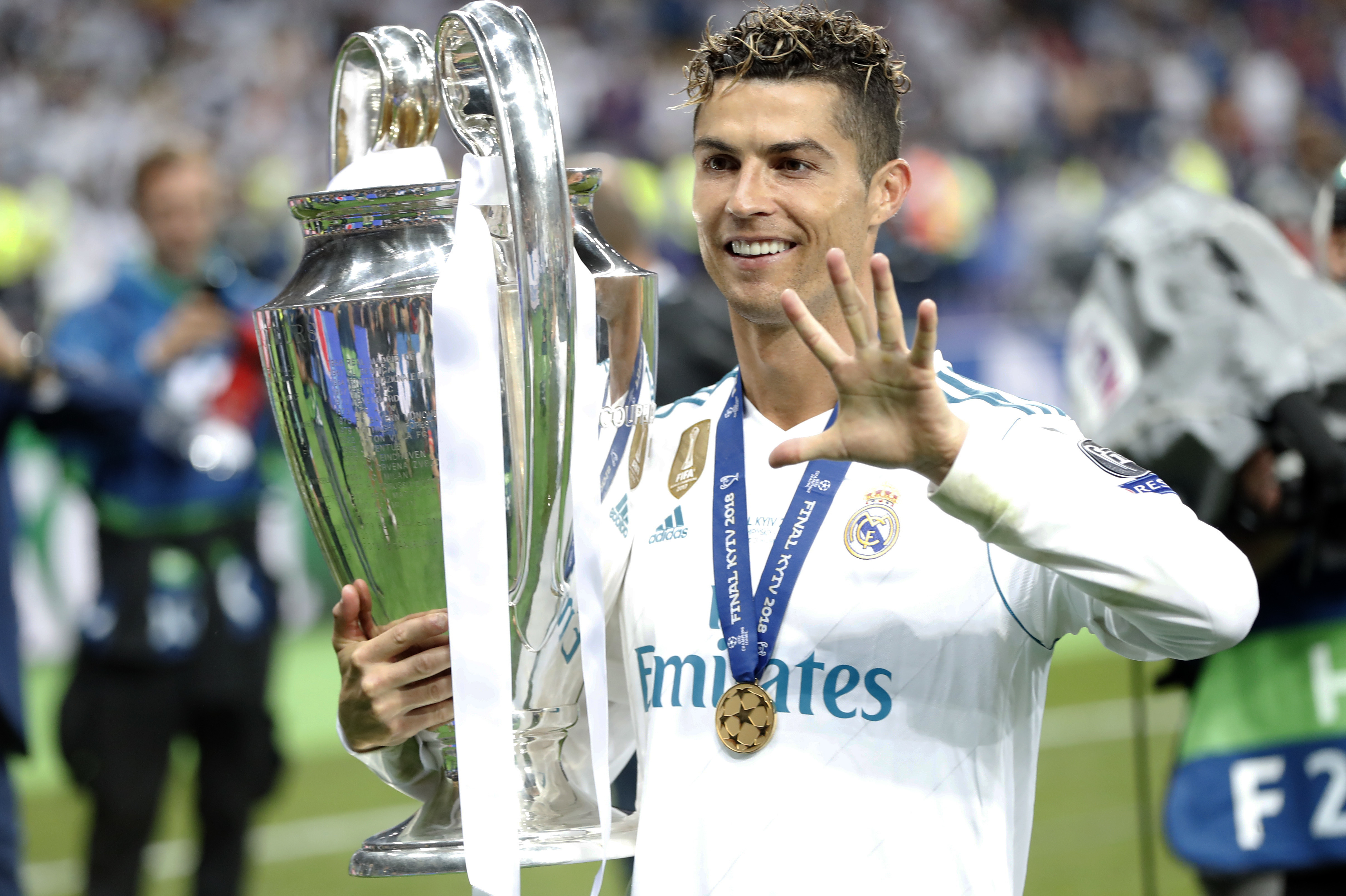 FILE - Real Madrid's Cristiano Ronaldo celebrates with the trophy after winning the Champions League Final soccer match between Real Madrid and Liverpool at the Olimpiyskiy Stadium in Kiev, Ukraine, Saturday, May 26, 2018. 