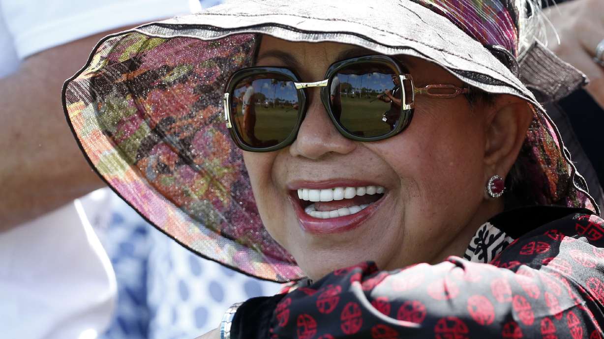 FILE - Kultida Woods, Tiger Woods' mother, watches as her son plays on the third hole during the third round of the Honda Classic golf tournament, Saturday, Feb. 24, 2018 in Palm Beach Gardens, Fla.