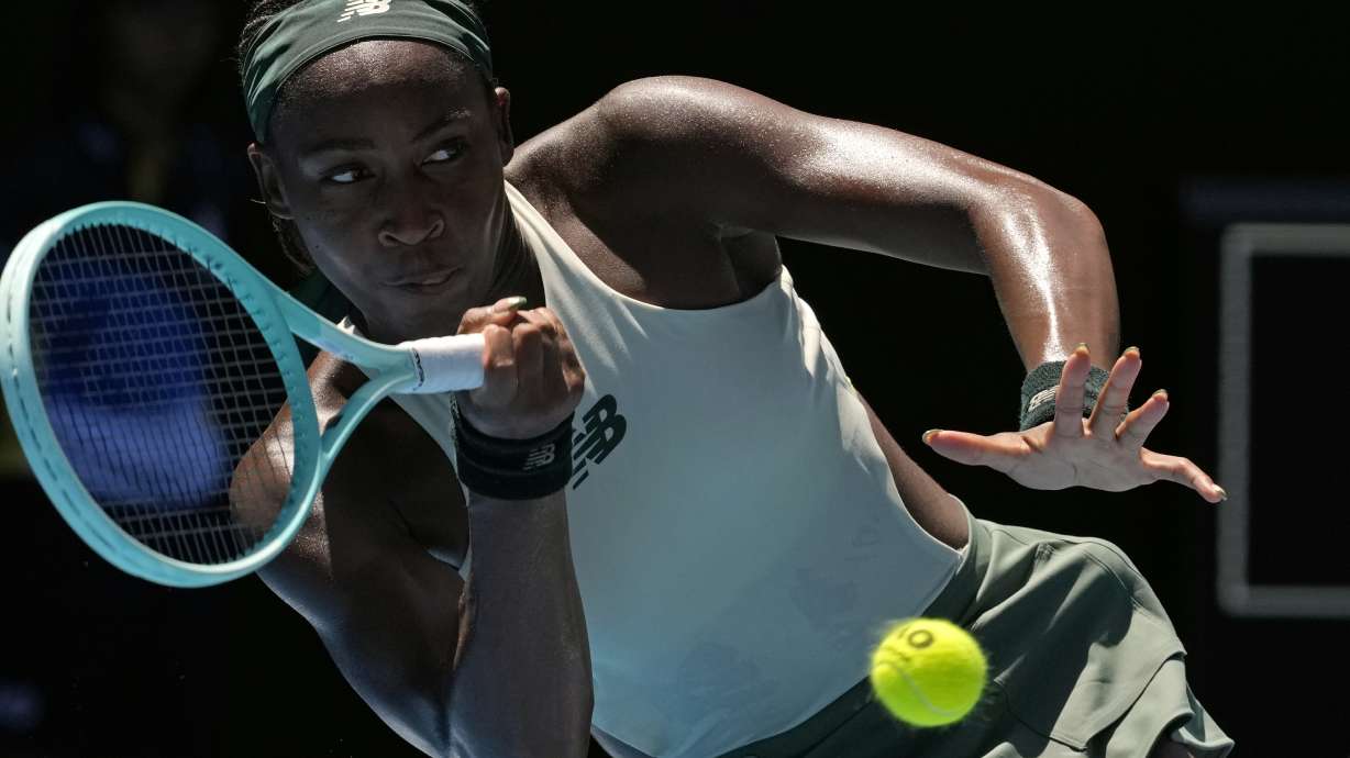 Coco Gauff of the U.S. plays a forehand return to Paula Badosa of Spain during their quarterfinal match at the Australian Open tennis championship in Melbourne, Australia, Tuesday, Jan. 21, 2025.