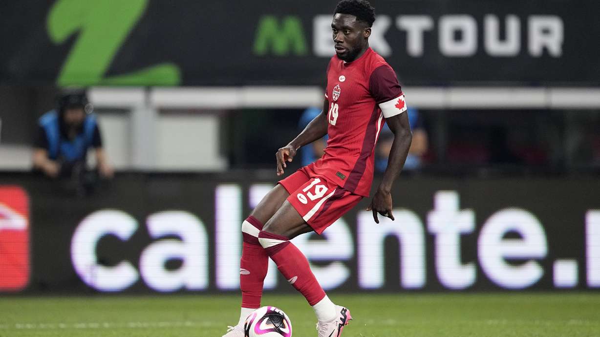 FILE - Canada defenseman Alphonso Davies controls the ball during an international friendly soccer match against Mexico Tuesday, Sept. 10, 2024, in Arlington, Texas.