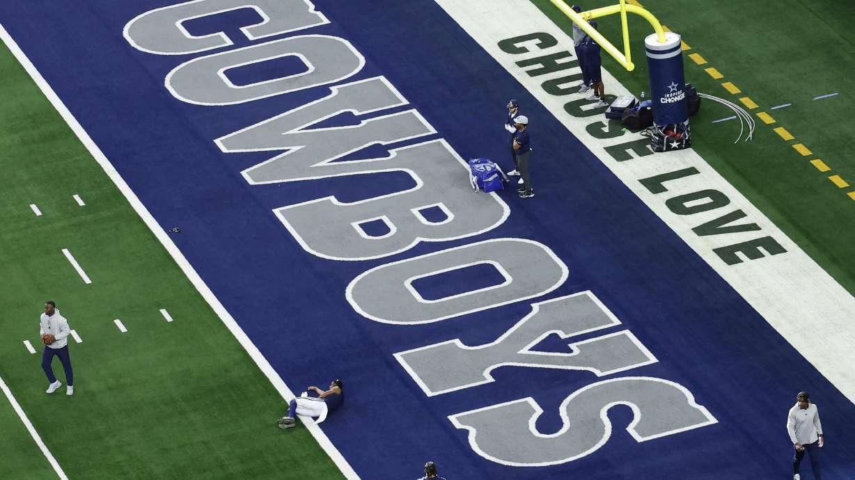 FILE - The word's "Choose Love" are displayed in the end zone at AT&T Stadium before a NFL football game between the Washington Commanders and the Dallas Cowboys on Sunday, Jan. 5, 2025, in Arlington, Texas.