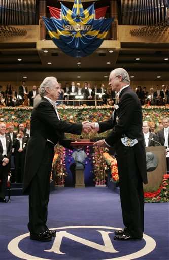 Dr. Mario R. Capecchi of the U.S., left, receives the Nobel Prize in Physiology or Medicine 2007 from King Carl Gustaf of Sweden, right, for the discovery of principles for introducing specific gene modifications in mice by the use of embryonic stem cells at a prize giving ceremony in Stockholm Concert Hall, Stockholm, Dec. 10, 2007. (AP photo/Scanpix Sweden, Jonas Ekstromer)