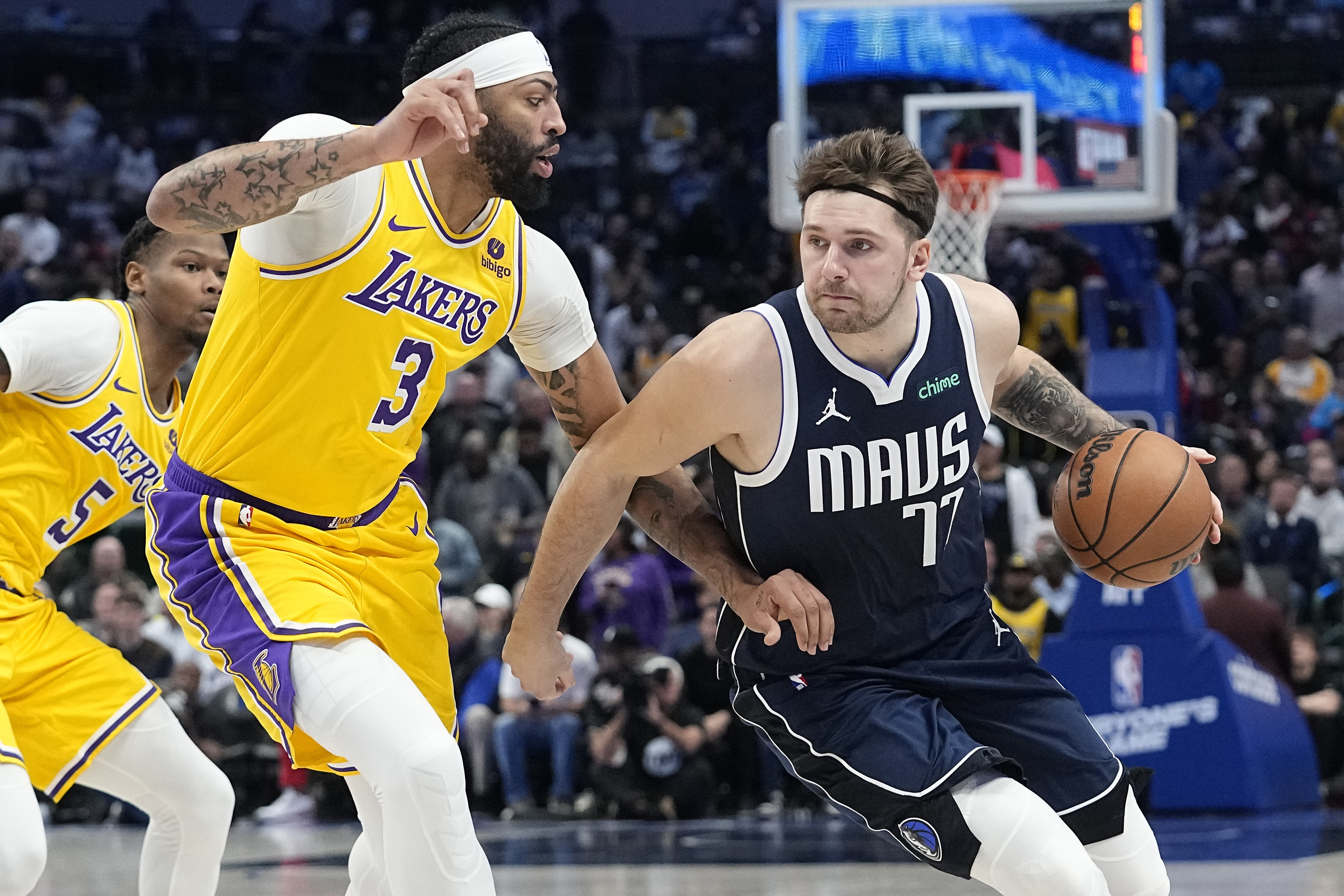 FILE - Dallas Mavericks guard Luka Doncic drives against Los Angeles Lakers forward Anthony Davis (3) during the first half of an NBA basketball game in Dallas, Tuesday, Dec. 12, 2023. 