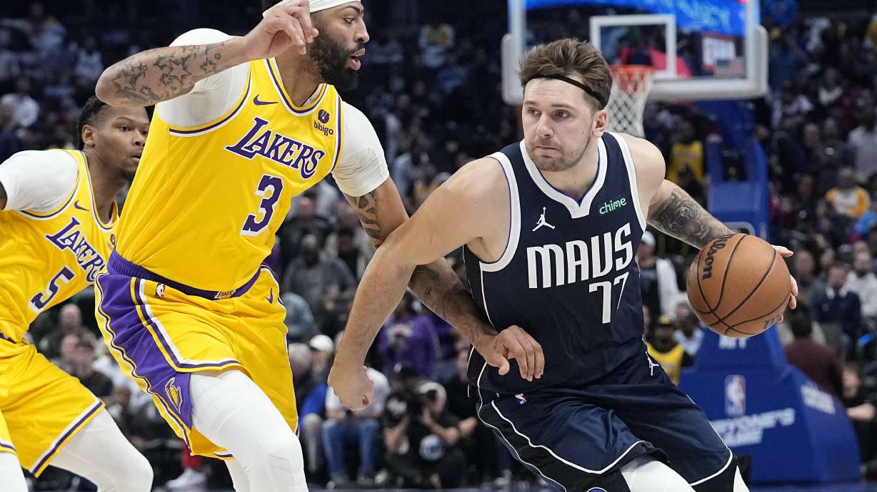 FILE - Dallas Mavericks guard Luka Doncic drives against Los Angeles Lakers forward Anthony Davis (3) during the first half of an NBA basketball game in Dallas, Tuesday, Dec. 12, 2023.