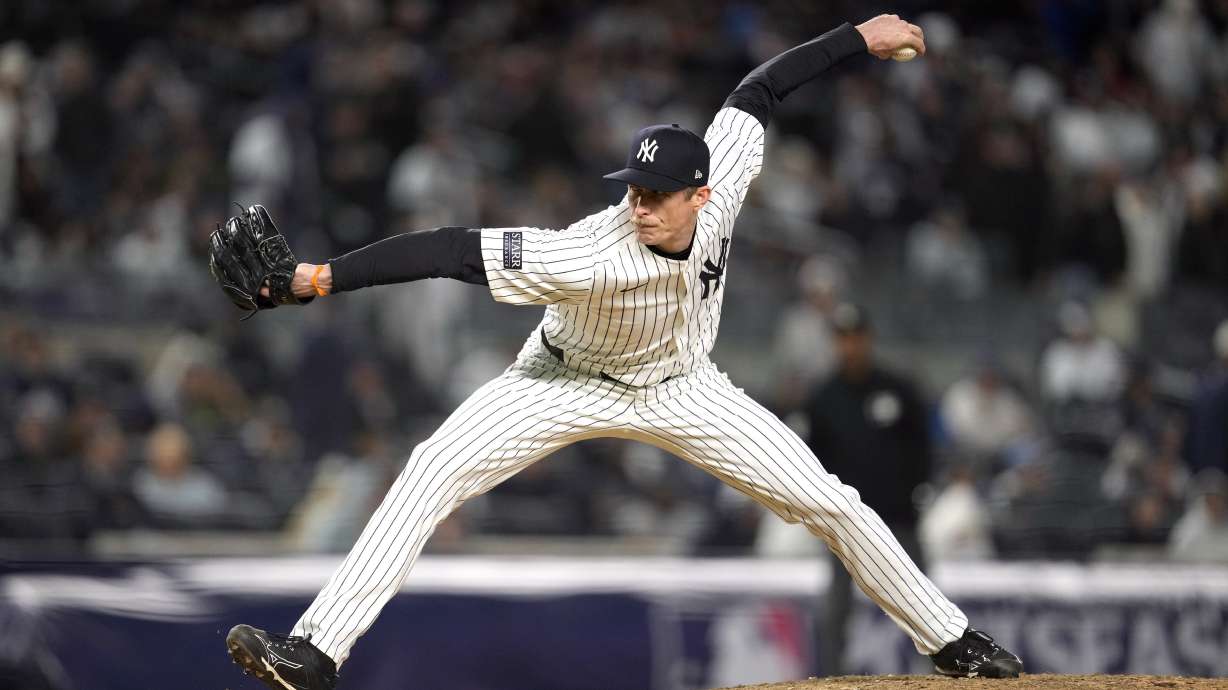 FILE - New York Yankees relief pitcher Tim Hill throws against the Cleveland Guardians during the eighth inning in Game 1 of the baseball AL Championship Series, Oct. 14, 2024, in New York.