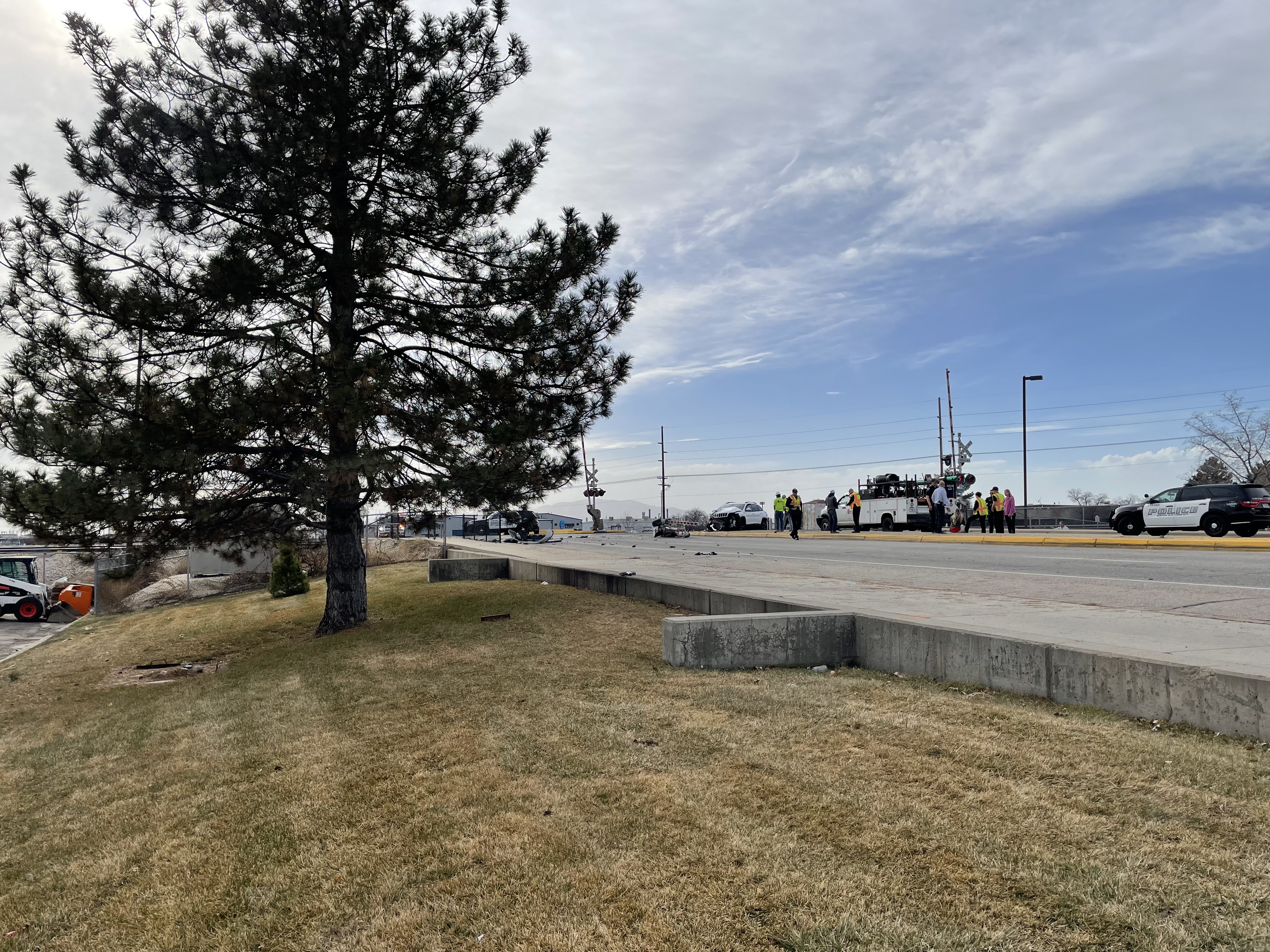 A driver narrowly escaped getting hit by a train after their car was rear ended and pushed onto train tracks in Layton Tuesday afternoon.