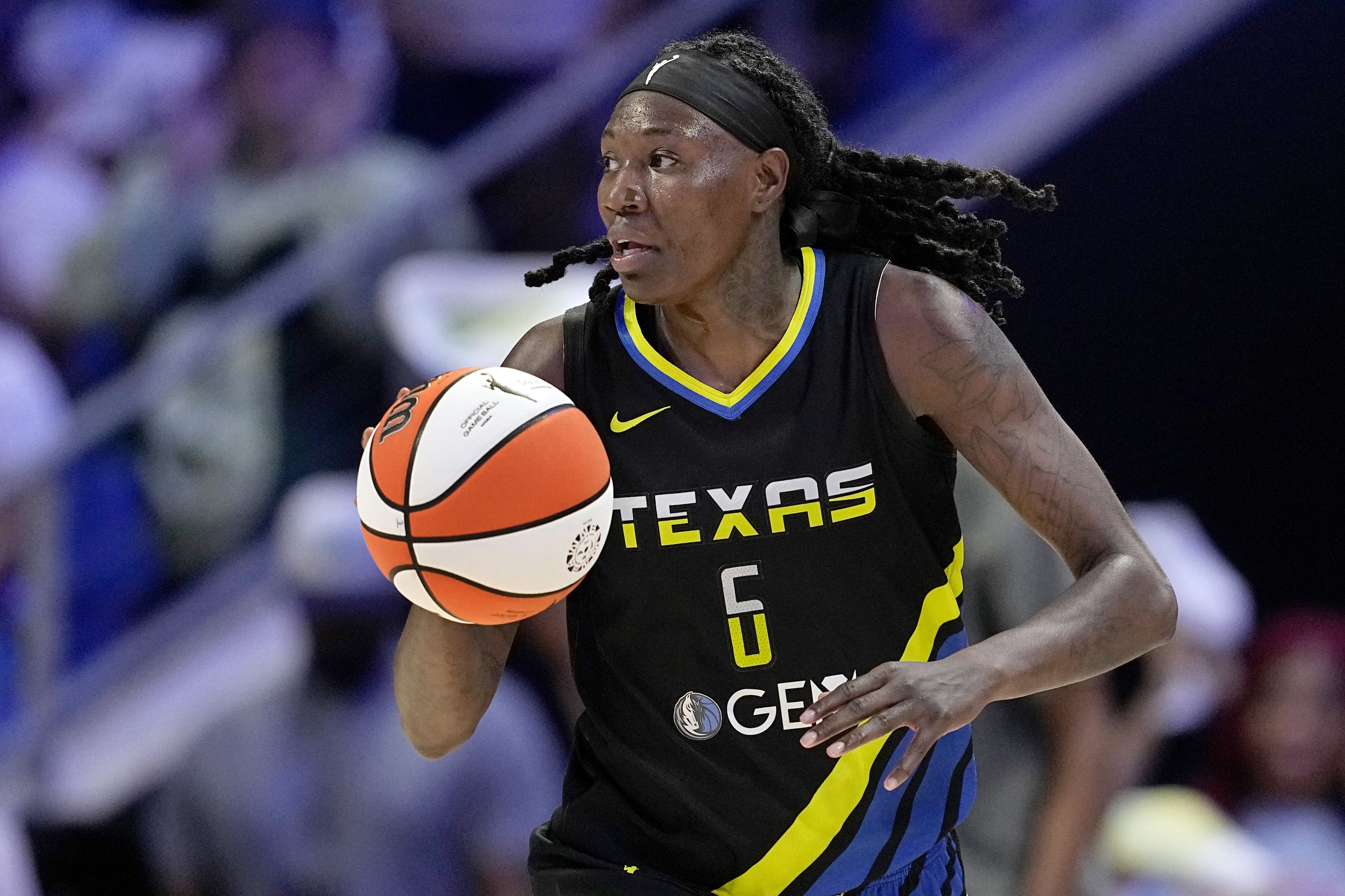FILE - Dallas Wings' Natasha Howard handles the ball as she works against the Indiana Fever in a WNBA basketball game on Sept. 1, 2024, in Arlington, Texas. 