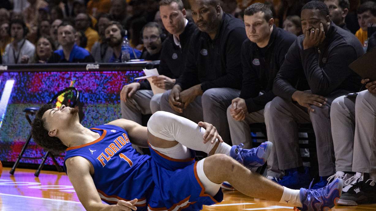 Florida guard Walter Clayton Jr. (1) grimaces as he falls to the floor during the second half of an NCAA college basketball game against Tennessee, Saturday, Feb. 1, 2025, in Knoxville, Tenn.