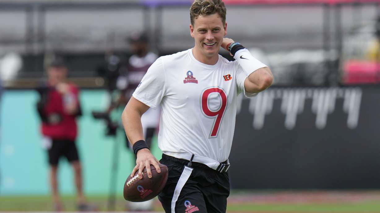 FILE - AFC quarterback Joe Burrow, of the Cincinnati Bengals, smiles after he was sacked during the flag football event at the NFL Pro Bowl, in Orlando, Feb. 2, 2025.
