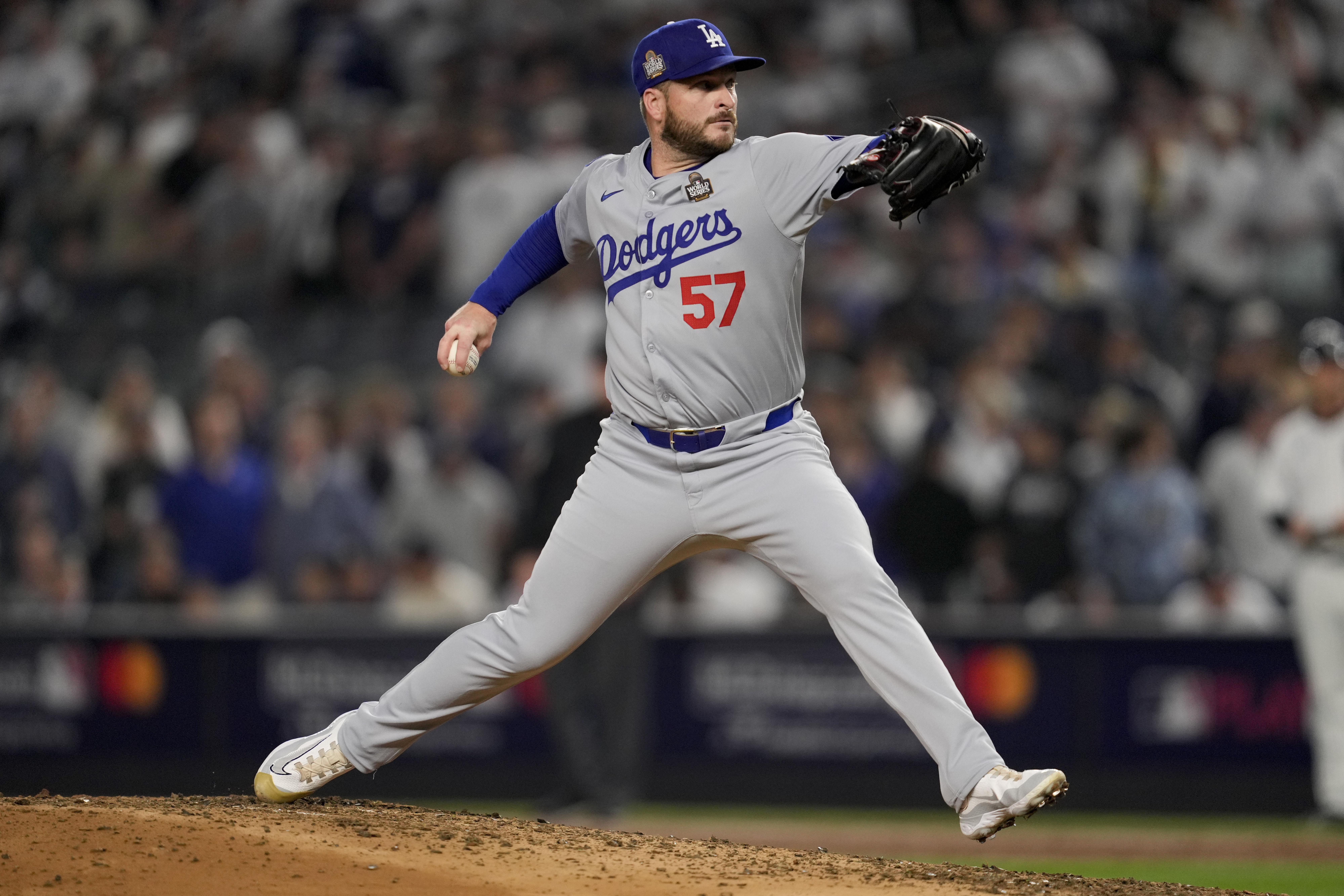 FILE - Los Angeles Dodgers pitcher Ryan Brasier throws against the New York Yankees during the third inning in Game 5 of the baseball World Series, in New York, Oct. 30, 2024.