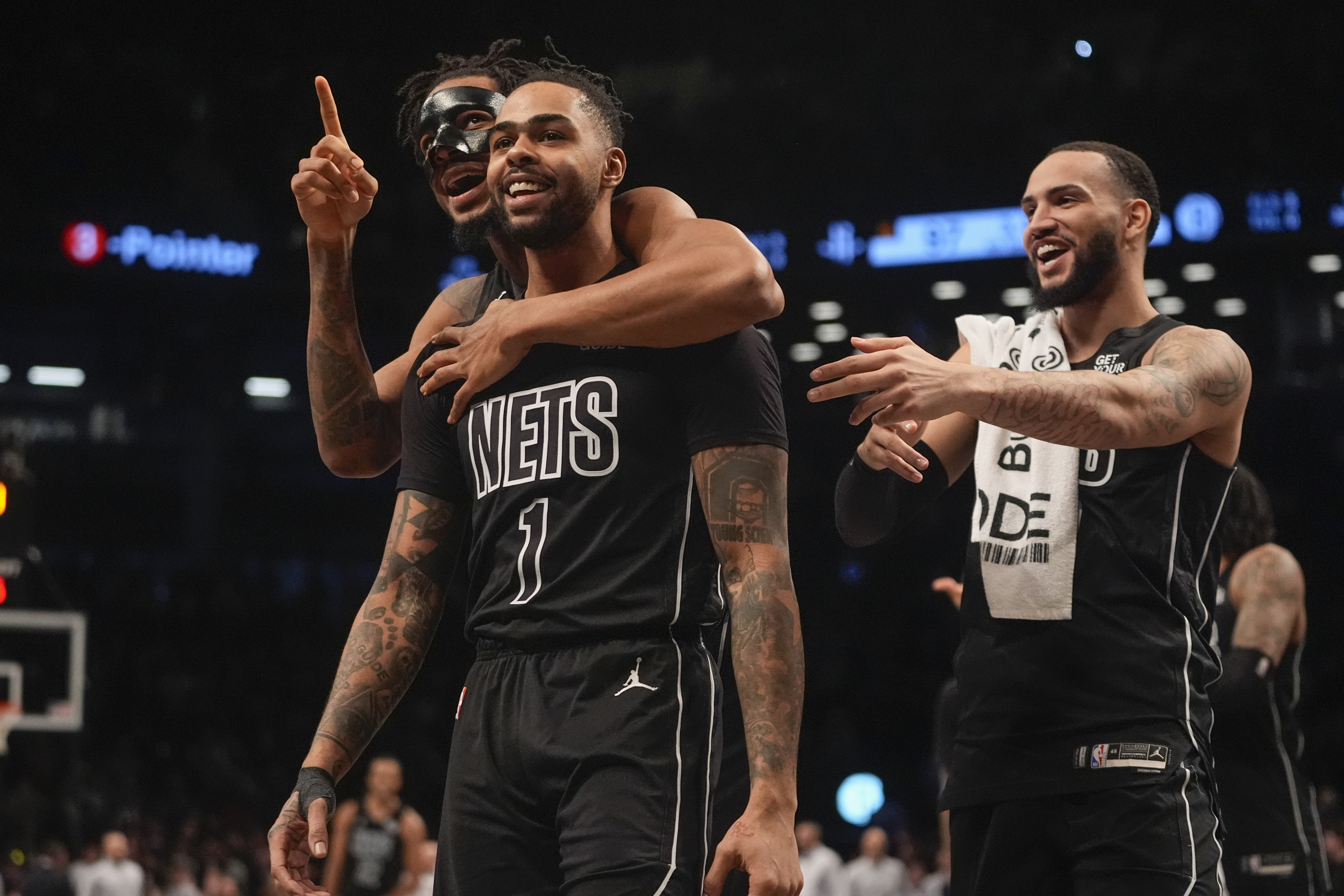 Brooklyn Nets' D'Angelo Russell (1) celebrates with teamamtes after making a three-point shot during the second half of an NBA basketball game against the Houston Rockets Tuesday, Feb. 4, 2025, in New York.